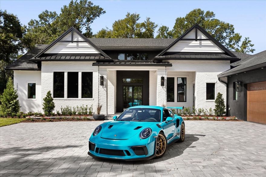 Welcome to 1206 Sutter Avenue, the crown jewel of Gotha, FL, where luxury and modern elegance converge. This newly constructed estate, spanning an impressive 5,772 of living square feet, is set on an expansive lot just under an acre, offering an extraordinary living experience. 
As you enter through the grand 8-foot iron entry doors, you are welcomed into the foyer, with its exquisite checkered marble flooring. The living room, with its soaring vaulted ceiling and custom beams, is anchored by a Montigo DelRay 46” gas fireplace, perfect for both intimate gatherings and grand celebrations. The gourmet kitchen is a culinary masterpiece. It features Rift white oak cabinetry with inset soft-close doors and drawers, a luxurious double-thick nosing in marble-style quartz, and two full-size sinks with Brizio faucets. The 48” Thermador Pro Grade gas range is complemented by a wall-mounted Brizio pot filler. With two Thermador stainless steel dishwashers, a Thermador 30” double oven, and an oversized 66” Frigidaire professional side-by-side fridge and freezer, designed to impress even the most discerning chef. The custom large walk-in pantry caters to every culinary desire. Retreat to the primary suite featuring a luxurious ensuite bath, adorned with Carrara Marble Mosaic flooring, a curbless shower with body jets, and custom vanities. The second floor hosts a private guest bedroom with an ensuite bathroom, offering a comfortable space for visitors. The custom home office exudes sophistication, with built-in bookshelves, creating an ideal environment for productivity. Entertainment reaches new heights in the game room, complete with built-in speakers, a bar with a Samsung smart fridge, and large patio sliders leading to the pool. The outdoor space is an entertainer's paradise, featuring a pool, spa, and a fully equipped outdoor kitchen.

Enjoy an oversized four-car garage, a fully fenced yard lined with oak trees, all within a private setting, ensuring unparalleled comfort and privacy. 1206 Sutter Avenue is equipped with state-of-the-art amenities, offering a lifestyle of unmatched elegance and grandeur. Schedule your private tour today.