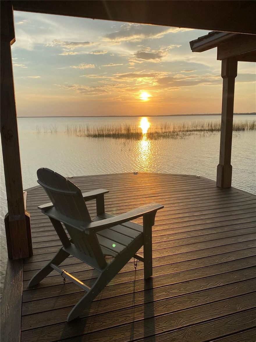 Discover the ultimate lakefront retreat on the shores of East Lake Tohopekaliga an impeccably appointed, custom-built residence offering the perfect blend of luxury, comfort, and resort-style living. Located in an exclusive gated community, this 5 bedrooms / 3 bathrooms home showcases timeless craftsmanship, breathtaking water views, and exceptional indoor–outdoor spaces designed for both relaxation and entertaining.

Step inside to soaring 10-foot ceilings, elegant tray accents, crown molding, and rich travertine flooring throughout the main level. A striking wood-floored stairwell serves as an architectural focal point, setting the tone for the home’s sophisticated design. The open-concept layout features a spacious family room with a wood-burning fireplace and pocket sliding glass doors that fully open to the screened lanai, creating a seamless connection between indoor comfort and outdoor living.

A formal dining room, charming dinette, and gourmet kitchen complete the heart of the home featuring dual wall ovens, a cooktop, walk-in pantry, and abundant cabinetry. The expansive primary suite is conveniently located on the first floor, offering serene lake views, dual walk-in closets, and a spa-inspired bathroom with a garden tub and separate walk-in shower. Two additional bedrooms on the main level include a flexible third bedroom ideal for a home office or private sitting room.

Upstairs, you’ll find two generously sized bedrooms with walk-in closets, along with a versatile living area perfect for a bonus room, game room, or media space complete with plumbing ready for a future wet bar. Step out onto the large upper balcony to enjoy sweeping lake and sunset views that are truly unforgettable.

Outdoor living is elevated with a screened-in pool featuring water features, a pavered lanai, and plumbing ready for a full outdoor kitchen ideal for entertaining, relaxing, and enjoying the lakeside breeze. The private dock includes a covered seating area, boat slip, and low-maintenance synthetic decking, offering endless opportunities for boating, fishing, and sunset cruising.

Additional features include a tile roof, 3-car garage, pavered driveway, and a dedicated laundry room.

Perfectly situated near Lake Nona, this home offers quick access to Medical City, the VA Hospital, Nemours Children’s Hospital, top-rated restaurants, vibrant shopping, and the Orlando International Airport, making everyday convenience and world-class amenities just minutes away.

Experience unforgettable sunsets, spacious luxury living, and the rare opportunity to own a true lakefront lifestyle on Lake Toho.