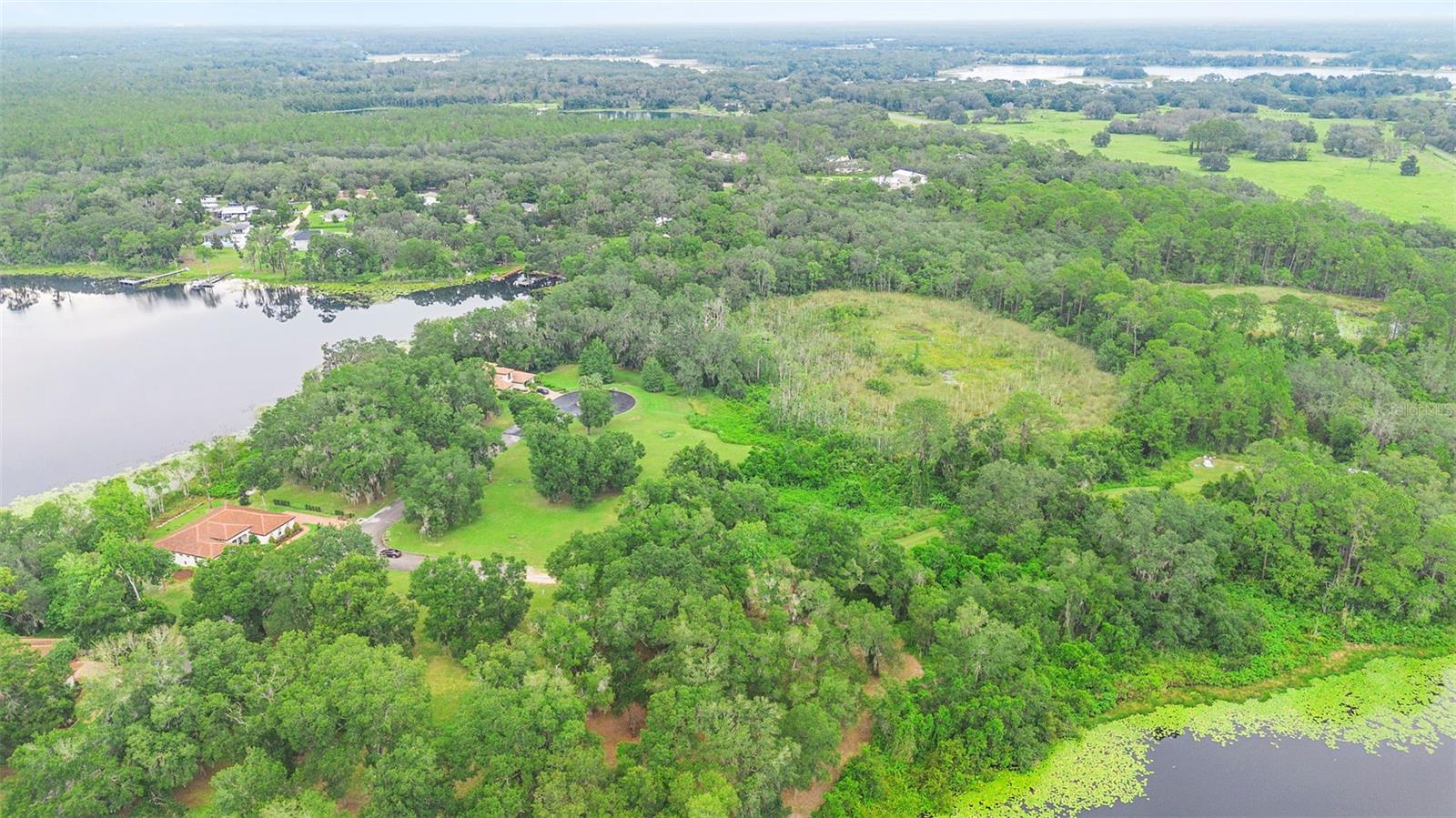 DELAND: The Lakes of DeLand community is known for its distinctive architecture, tile roofs, paver sidewalks and driveways, and its connection to nature. This .19 acre lot is across from Lake Mamie. You can build you dream home with all the upgrades you have always wanted. In the gated Community Residents enjoy access to three natural lakes, walking paths, and non-motorized boat access. While the setting feels private and serene, you are just minutes from everything. The home is located less than two miles from the new Super Walmart, with more than 60 restaurants within a five-mile radius. Conveniently situated between Orlando and Daytona Beach, this home offers quick access to golf, beaches, and world-renowned attractions throughout Central Florida.