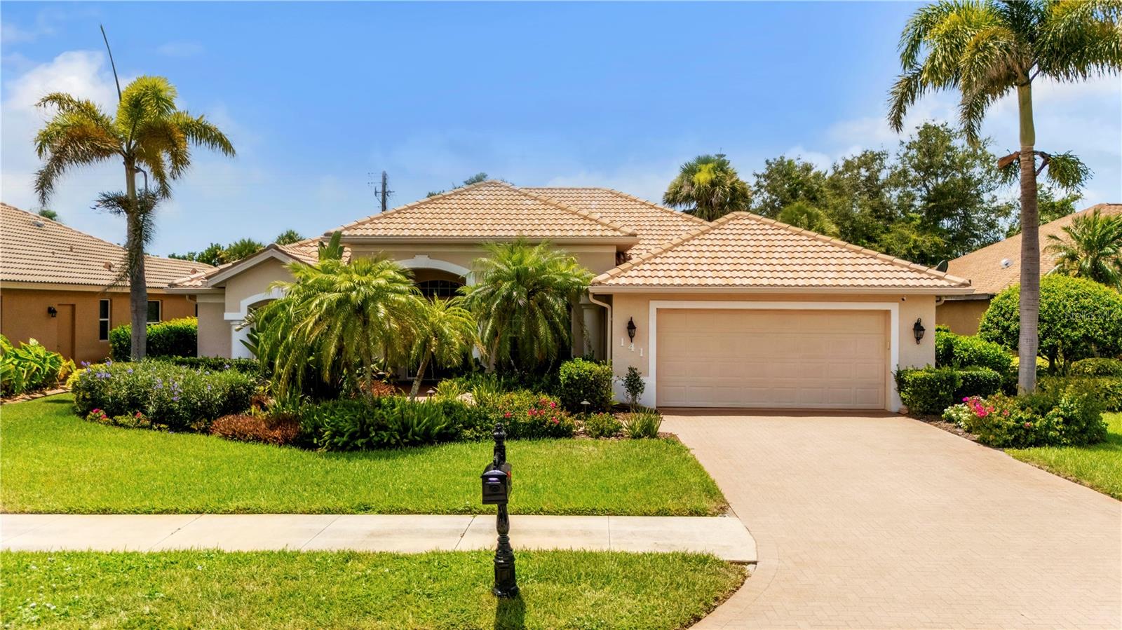 This meticulously maintained custom home is located in the highly sought-after Blue Heron Pond neighborhood. The home offers beautiful amenities including, an oversized primary bedroom with dual walk-in closets. Other amenities include: a luxurious ensuite bathroom with a soaking tub and Roman walk-in shower, a gourmet kitchen with new stainless steel appliances, a family room, a formal dining room/den office, and a laundry room. The split floorplan features a gourmet kitchen with updated stainless steel appliances and dining space. The kitchen seamlessly flows onto the covered lanai where you can relax and enjoy the tranquility of your oversized custom designed pool and spa. You can also take in the beautiful view and natural privacy offered by the tall hedges and tropical planting throughout the yard. The house also includes: a generator panel, hurricane shutters, newer AC and roof, wood flooring, a tile roof, and irrigation. The house has 2,000+ sq ft of living area and is situated in a low-HOA neighborhood. Call today for a showing.