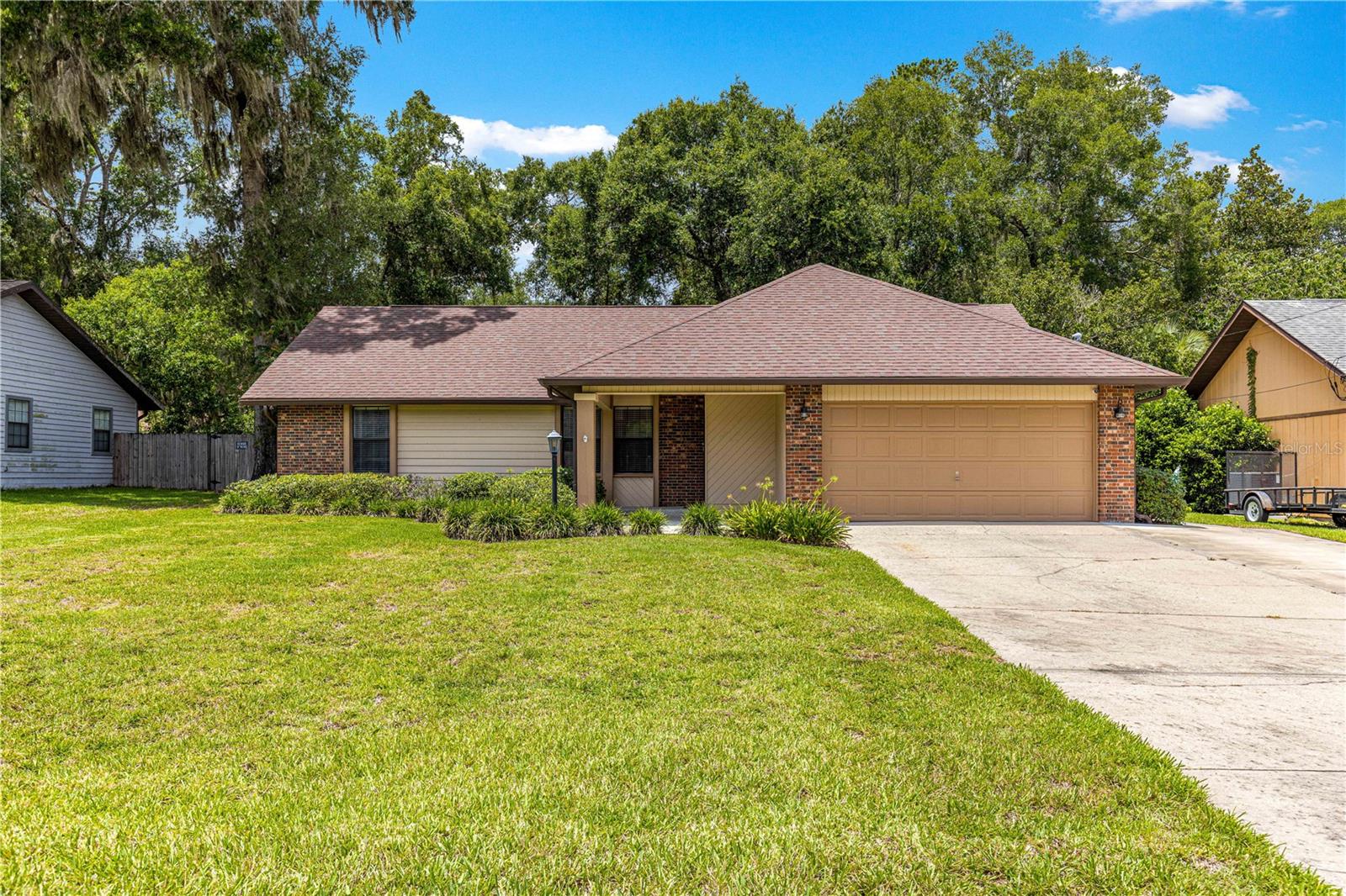 Capture the Charm, Love the Space, Live the Location - Welcome to this meticulously cared-for 3-bedroom, 2-bathroom home nestled in a sought-after SE Ocala neighborhood. Light and bright home boasting over 3,000 sq ft under roof, this spacious split floor plan offers comfort, character, and functionality at every turn. Step inside to find a large family room with soaring cathedral ceilings and a warm mix of wood , tile and carpet flooring, perfect for relaxing or entertaining. The updated kitchen features Solar tube for extra light, stainless steel appliances, a breakfast bar, and seamless flow into the cozy dining room. The inviting living room centers around a beautiful fireplace, adding charm and warmth. Retreat to the master suite, complete with a double vanity, walk-in closet, jetted tub, and French doors that open to the patio. Two additional guest bedrooms and a guest bath provide ample space for family or visitors. Enjoy Florida living year-round in the expansive tiled sunroom/bonus room under air, with a convenient laundry closet. A screen-enclosed porch and open patio overlook the private, fully fenced backyard—ideal for gatherings, gardening, or peaceful mornings. A storage shed adds even more practicality. With a 2-car garage and a prime location close to schools, shopping, and parks, this home blends comfort, style, and convenience in one remarkable package.
