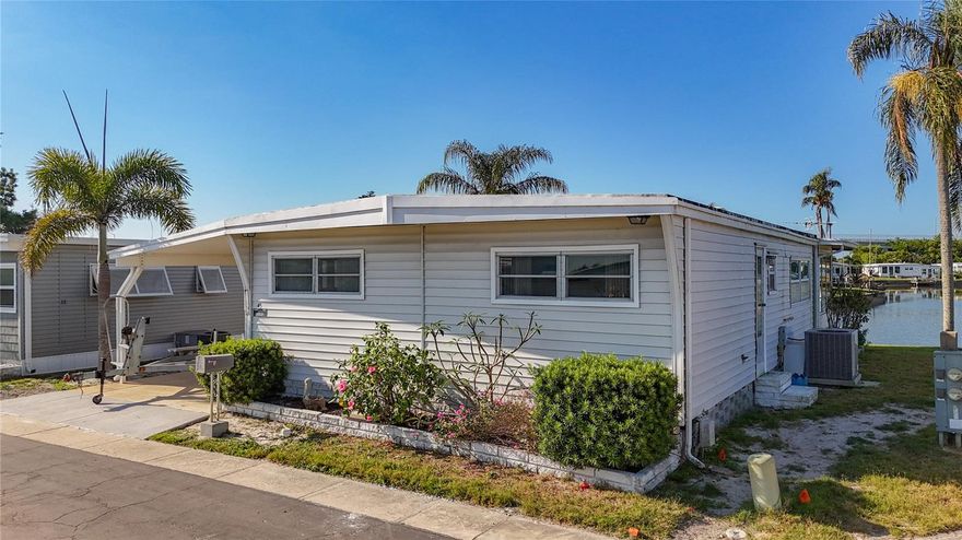 WATERFRONT opportunity in a vibrant 55+ community on Lake Seminole! This home is full of potential and ready for your personal touch—perfect for buyers looking to customize and add value in a prime location.  Sunroom can add an additional 240 sq ft if heat & AC is added.     

Located in Holiday Shores, residents enjoy an active, resort-style lifestyle with amenities that include a heated pool, shuffleboard, fitness center, library, putting green, and direct access to boating, kayaking, jet skiing, and fishing on the lake. The community offers a peaceful, tucked-away setting while still being just minutes from shopping, dining, and everyday conveniences.

Love the beach? Beautiful Indian Rocks Beach is only a 15-minute drive, and world-famous Clearwater Beach is just a few miles further. Commuting and travel are easy with Tampa International Airport about 30 minutes away and St. Pete–Clearwater International Airport just 20 minutes away.
The park has recently completed a full sewer pipe replacement at no cost to homeowners, and the county is actively working on improvements to restore and enhance the community.
Don’t miss your chance to own waterfront property in a highly desirable location at an affordable price—schedule your showing today!