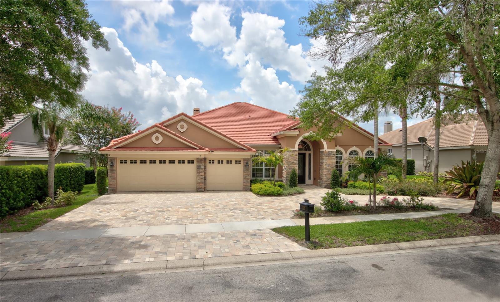 One or more photo(s) has been virtually staged. Welcome to this beautifully updated waterfront home in the desirable Kentford Garden neighborhood of Heathrow. Built by David Weekley Homes, this spacious 5-bedroom, 4-bathroom home offers over 3,900 square feet of comfortable living space. Located in the sought-after Heathrow golf community, you’ll enjoy easy access to I-4, 417, and 429, making travel around town a breeze. The home has been carefully maintained and offers a smart, flexible layout. All bedrooms are located on the first floor for convenience, while upstairs you’ll find a large bonus room with a full bath—perfect for a playroom, guest space, or home theater. There’s also a private office for working from home. The renovated kitchen is a true standout, featuring high-end appliances, quartz countertops, and a stylish tile backsplash. It opens up to the cozy family room, complete with a wood-burning fireplace—great for entertaining or relaxing with family. The spacious master suite includes tray ceilings, a separate sitting area, and a fully remodeled bathroom with double vanities, a large walk-in shower, garden tub, and a huge custom closet. Outside, enjoy year-round outdoor living in the large covered and screened lanai, which overlooks a heated pool and peaceful water views. The home also features a brand-new paver driveway with a roundabout for extra parking, wood flooring throughout the main living areas, updated guest baths, a whole-house water purification system, and a fully fenced backyard. As part of the Heathrow community, you'll also have access to 24/7 gated security, Sawyer Lake Park with its playground and sports courts, and a clubhouse perfect for events. This is the kind of home that has it all—space, comfort, and a great location. Come see it for yourself—schedule your private showing today!