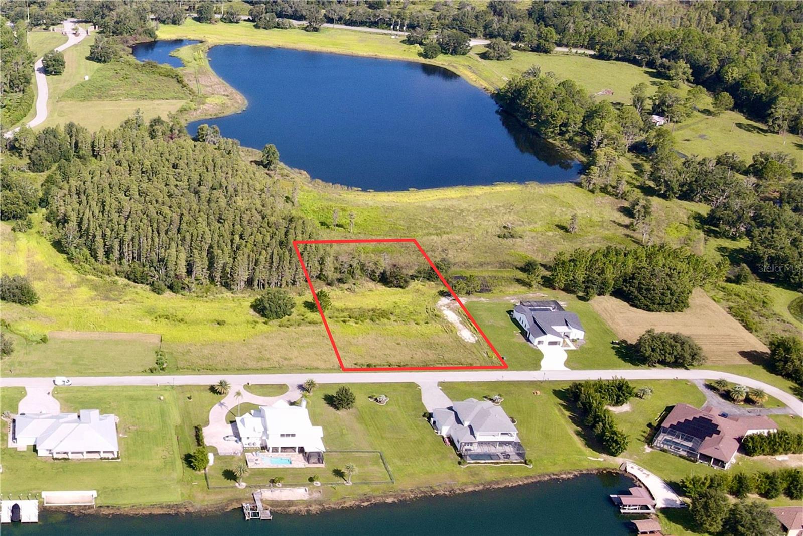 Outlaw Ridge offers seven spacious residential lots ranging from 1 to 1.88 acres, nestled within a private, gated community designed for custom-built homes. Located in a quiet and scenic setting, the community offers a peaceful atmosphere surrounded by nature
and is ideal for those seeking a quiet lifestyle.
The available lots include a mix of wetlands and floodplain areas. Many of the sites back up to wooded areas or designated conservation land, offering serene views and privacy. Utilities are well and septic.
The lots are located within Outlaw Ridge, a gated community, on Outlaw Way and Hideout Trail in Land O' Lakes in Pasco County. Outlaw Ridge is situated on Ehren Cutoff. Ehren Cutoff connects US 41 to State Road 52.
The site is approximately 10 minutes from US Highway 41, where nearby medical shopping, and schools are located. Additionally, it's 1.6 miles from State Road 52, 5.9 miles from I-75, and 7.6 miles from the Suncoast Parkway. The area offers a mix of rural and urban surroundings. Due to its proximity to major thoroughfares, it's just a short commute from Wesley Chapel (20 minutes), Dade City (25 minutes), Brooksville (30 minutes), New Port Richey (40 minutes), Tampa International Airport (40 minutes), downtown Tampa (40 minutes), and downtown St. Petersburg (50 minutes).