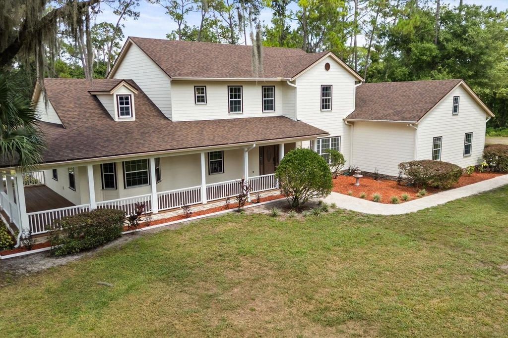 Photo of 27012 Grand Oak Lane, Tavares, FL 32778 (MLS # O6401285)