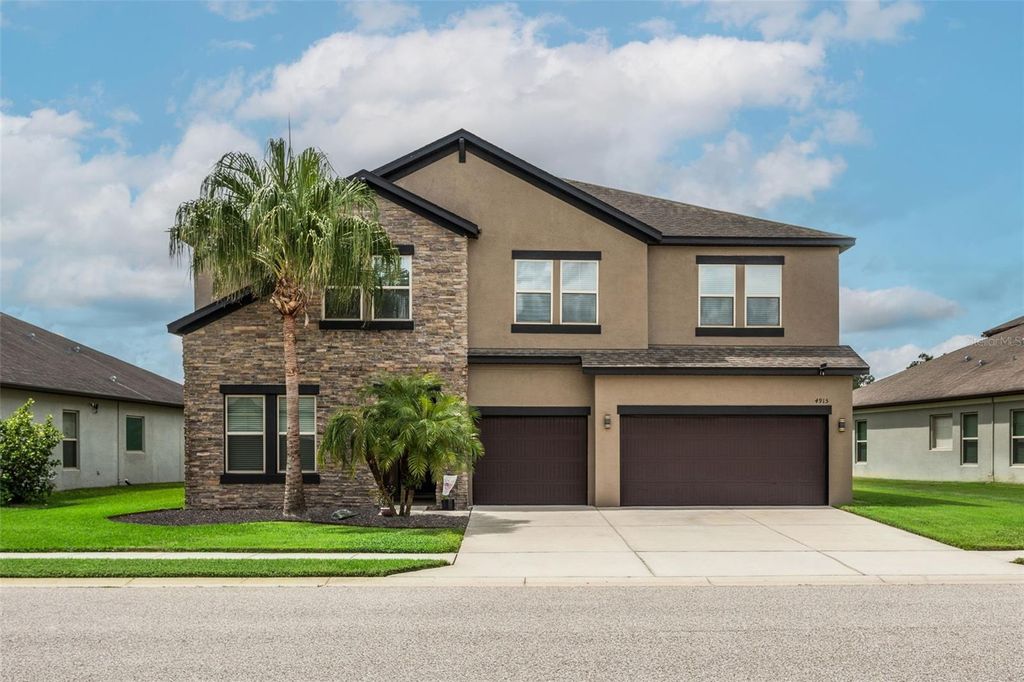 Photo of 4915 Butler National Drive, Wesley Chapel, FL 33543 (MLS # TB8429348)