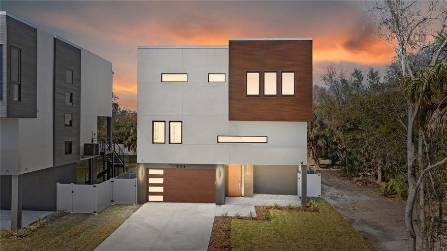 Under Construction. This stunning new three-story residence by Danva Construction perfectly blends modern luxury with resilient, high-end design. Located at 504 Federal Street in the desirable waterfront community of Oldsmar, this home is built for peace of mind with a solid concrete block structure, pilings, impact-resistant windows, and a durable TPO roof, all backed by a comprehensive builder warranty. The exterior is finished in Sherwin Williams Chantilly Lace, creating a clean, modern curb appeal enhanced by professional landscaping and a signature magnolia tree. Inside, the open-concept layout features soaring ceilings, porcelain tile flooring, and a gourmet kitchen that serves as a true showpiece. The kitchen is complete with a waterfall island, designer backsplash, and premium Bosch 800-series appliances. The luxurious primary suite offers a spa-inspired retreat with a freestanding soaking tub and porcelain tiled walls. Indoor-outdoor living shines with a second-floor porcelain tile balcony and a covered lanai. Note that some images are virtually staged to show the home's potential. BUYER INCENTIVES: Take advantage of an $80,000 pool credit to be installed after closing by a vendor of the buyer's choice (ask for details; restrictions apply). Additionally, secure an interest rate buy-down when using our preferred lender, Revolution Mortgage. Perfectly positioned just one block from Tampa Bay and five minutes to Mobbly Bayou Beach Park, this home offers a lifestyle of privacy and convenience. Oldsmar is a charming waterfront community known for its parks and trails, with effortless access to Tampa International Airport (under 20 mins), Downtown Tampa (30 mins), and the world-famous beaches of Clearwater. The location is a true paradise for outdoor enthusiasts and urban commuters alike. You are steps away from the Upper Tampa Bay Trail, offering miles of scenic cycling and jogging paths. Just minutes away, the historic downtown Oldsmar district provides an array of boutique dining, local craft breweries, and community events like the annual Oldsmar Days. For shopping, the International Plaza and Bay Street are a short drive away, offering world-class retail experiences. Nature lovers will appreciate being adjacent to the Mobbly Bayou Wilderness Preserve, featuring over 400 acres of kayaking, hiking, and even a zip-line adventure park. Golfers can enjoy proximity to several championship courses including the nearby East Lake Woodlands Country Club. Whether you are catching a flight for business or spending a Saturday at Honeymoon Island State Park, this central location puts the very best of the Florida Gulf Coast right at your doorstep. This rare opportunity combines elevated finishes and resilient materials in a highly sought-after location.This rare opportunity combines elevated finishes and resilient materials in a highly sought-after location. All financing information is for illustrative purposes only and not a commitment to extend credit.