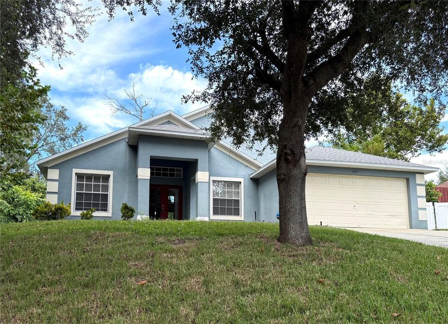 Great three bedroom two bath home on an oversized (1/4 Acre) elevated lot in Minneola. This property definitely has curb appeal!! Enter through the double glass doors to find a light filled spacious home with very high ceilings. The split floor plan gives everyone privacy. Formal living and dining rooms. The large family room is absolutely great for entertaining and features a built in nook for the TV and components. Keep walking and you will find yourself on the large spacious rear screened patio with no visible rear neighbors. The master bedroom features a walk-in closet and has an en-suite bath with separate shower and private water closet. Newer Roof. Solar panels should help save on the utility bill. Large two car garage and separate laundry room. This one will not last. Call today for more details.