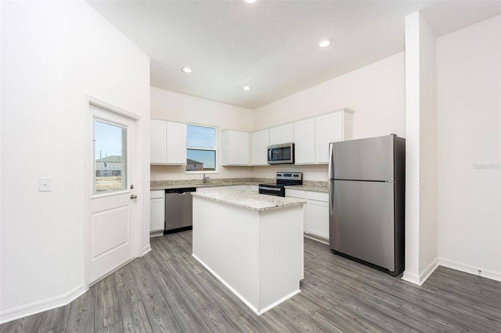 Photo of 878 Poppy Lane, Dundee, FL 33838 (MLS # TB8434377)