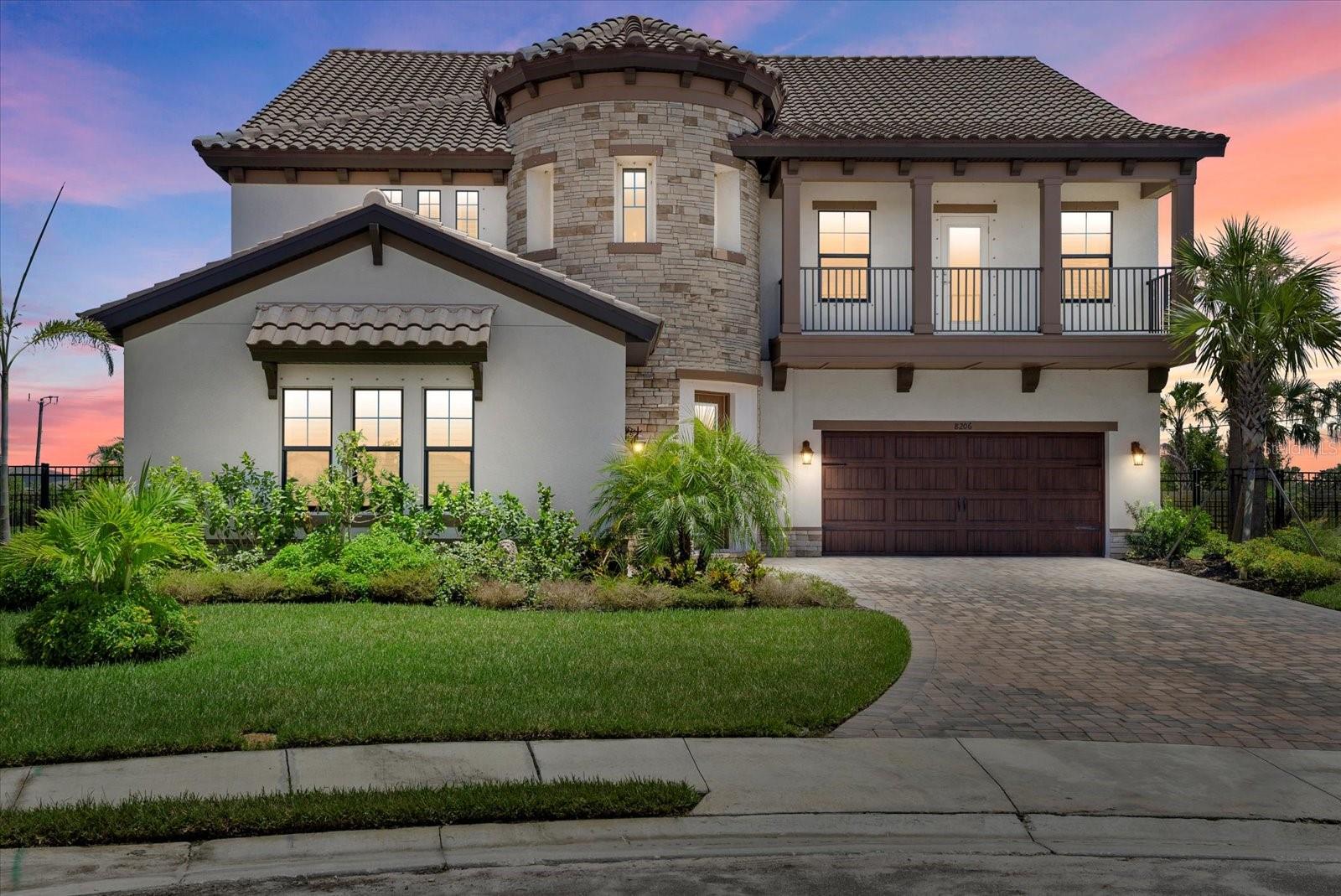 Introducing 8206 Rushton Place—your chance to own a showcase Madeira III home on the largest lot in the sought-after Crosswind Ranch of Parrish. Set at the end of a private cul-de-sac on over a quarter acre, this residence masterfully blends architectural grandeur with modern luxury. Designed to impress from the moment you arrive, the home’s Mediterranean-inspired façade features split garages, stone accents, and a signature rotunda entry that sets the tone for the elegance that follows. Step inside the soaring two-story foyer, where the angled staircase and natural light create a breathtaking welcome. The formal dining room and office with custom built-ins anchor the entrance, offering well-appointed spaces for entertaining and productivity. Throughout the home, refined details like crown molding elevate the overall design and add timeless character. The heart of the home is the expansive gourmet kitchen—an entertainer’s dream—featuring rich quartz countertops, built-in wall oven with a microwave above, gas cooktop, custom mosaic backsplash, and a large island that gracefully transitions into a built-in dining table. The great room flows effortlessly into the screened lanai through expansive sliders with electric shades, revealing a 2024 resort-style pool with triple waterfalls, built-in spa, sun shelf with in-water loungers, and Italian marble decking beneath a soaring two-story screen enclosure. Downstairs, a guest suite with a full bath doubles as a convenient pool bath, while a stylish powder room completes the main level. Durable yet elegant, luxury vinyl plank flooring extends throughout the first floor, enhancing the home’s inviting ambiance. Upstairs, discover a versatile loft with wet bar, three oversized secondary bedrooms—including two that share a Jack-and-Jill bathroom—and a custom laundry room with built-in cabinetry, quartz counters, a utility sink, folding counter, and drying bar for added functionality. The primary suite is a serene retreat with dual walk-in closets, a spa-inspired bathroom featuring quartz counters, dual vanities, a soaking tub, and a walk-in shower. Step out onto the full-length private balcony for tranquil views of your tropical oasis—an ideal space for morning coffee or evening relaxation. Additional highlights include a whole-house water filtration system, reverse osmosis in the kitchen and wet bar, and a spacious 3-car garage. As a resident of Crosswind Ranch, you’ll enjoy access to premier amenities including a lagoon-style pool and cabana, dog park, pickleball courts, and scenic walking trails. Ideally situated just 3 miles from Publix and all the vibrant shopping and dining options in North River Ranch, 2.5 miles to the brand-new Parrish Community Park, 3 miles to Parrish Community High School, and only 7 miles to I-75 with easy access to I-275 and the stunning Gulf Coast beaches—this home offers both luxury and location. Why wait for new construction when you can own this impeccably designed and upgraded Madeira III—where every detail has been curated for comfort, elegance, and enduring value? Welcome home to 8206 Rushton Place, Parrish!