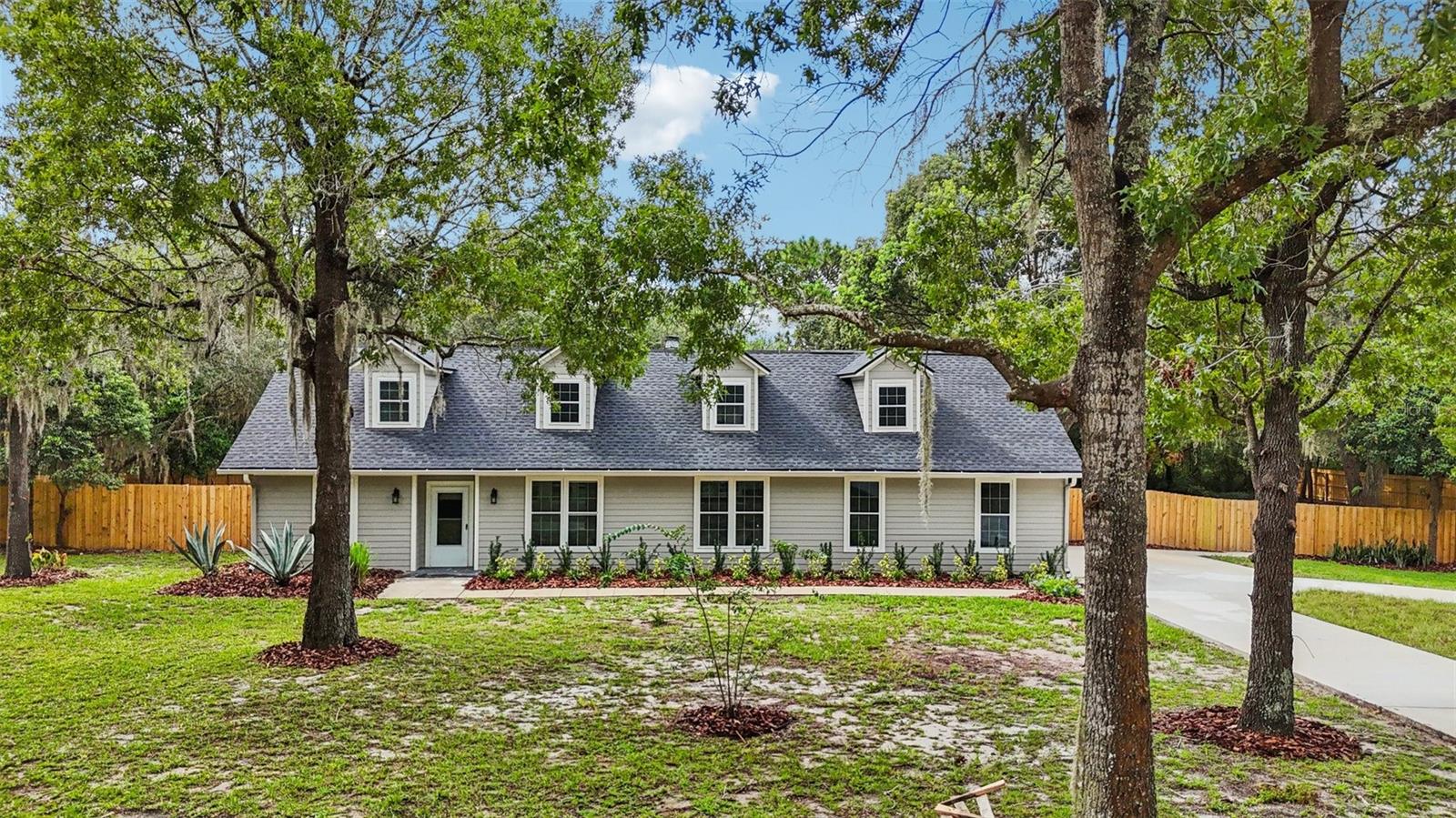 Welcome to this fully renovated 4-bedroom, 2.5-bath custom home offering over 2,500 sq. ft. of stylish living space with a 2 car garage on a rare 1-acre homesite in Sanford. Thoughtfully updated from top to bottom, this property blends modern comfort with timeless appeal.
Step inside to discover a bright, open layout ideal for both everyday living and entertaining. The new gourmet kitchen features sleek finishes and flows seamlessly into spacious living and dining areas, creating the perfect gathering hub around the wood burning fireplace. New tile flooring covers the entire first floor, and the primary suite features a custom tiled walk-in shower, and a large walk-in closet. The upstairs features 3 large bedrooms and a loft area with new laminate flooring, and an updated bathroom.
Every detail has been upgraded for peace of mind, including a brand-new roof, cement siding, fence, and driveway, plus a GENERAC whole-house generator for uninterrupted comfort. The expansive backyard is fully fenced and features a large stone-paved open patio, a private canvas—whether you envision a pool, garden oasis, or outdoor entertaining space.
Located in a quiet community with NO HOA, yet just minutes from major highways, shopping, dining, and Sanford’s vibrant historic district, this property offers the best of both worlds: acreage living with city convenience.
Don’t miss this opportunity to own a turnkey home on a full acre in one of Central Florida’s most desirable areas. Call and schedule your showing today!