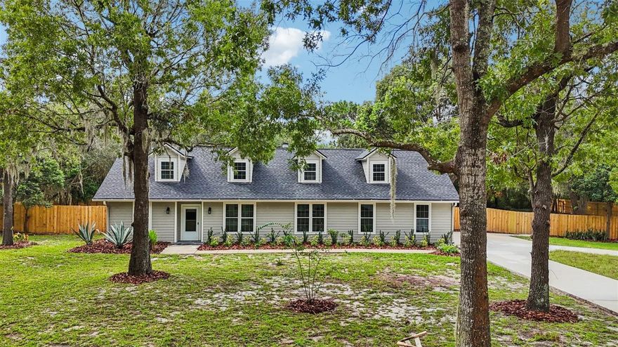 One or more photo(s) has been virtually staged. Welcome to this fully renovated 4-bedroom, 2.5-bath custom home offering over 2,500 sq. ft. of stylish living space with a 2 car garage on a rare 1-acre homesite in Sanford. Thoughtfully updated from top to bottom, this property blends modern comfort with timeless appeal.

Step inside to discover a bright, open layout ideal for both everyday living and entertaining. The new gourmet kitchen features sleek finishes and flows seamlessly into spacious living and dining areas, creating the perfect gathering hub around the wood burning fireplace. New tile flooring covers the entire first floor, and the primary suite features a custom tiled walk-in shower, and a large walk-in closet. The upstairs features 3 large bedrooms and a loft area with new laminate flooring, and an updated bathroom. 

Every detail has been upgraded for peace of mind, including a brand-new roof, cement siding, fence, and driveway, plus a GENERAC whole-house generator for uninterrupted comfort. The expansive backyard is fully fenced and features a large stone-paved open patio, a private canvas—whether you envision a pool, garden oasis, or outdoor entertaining space.

Located in a quiet community with NO HOA, yet just minutes from major highways, shopping, dining, and Sanford’s vibrant historic district, this property offers the best of both worlds: acreage living with city convenience.

Don’t miss this opportunity to own a turnkey home on a full acre in one of Central Florida’s most desirable areas. Call and schedule your showing today!