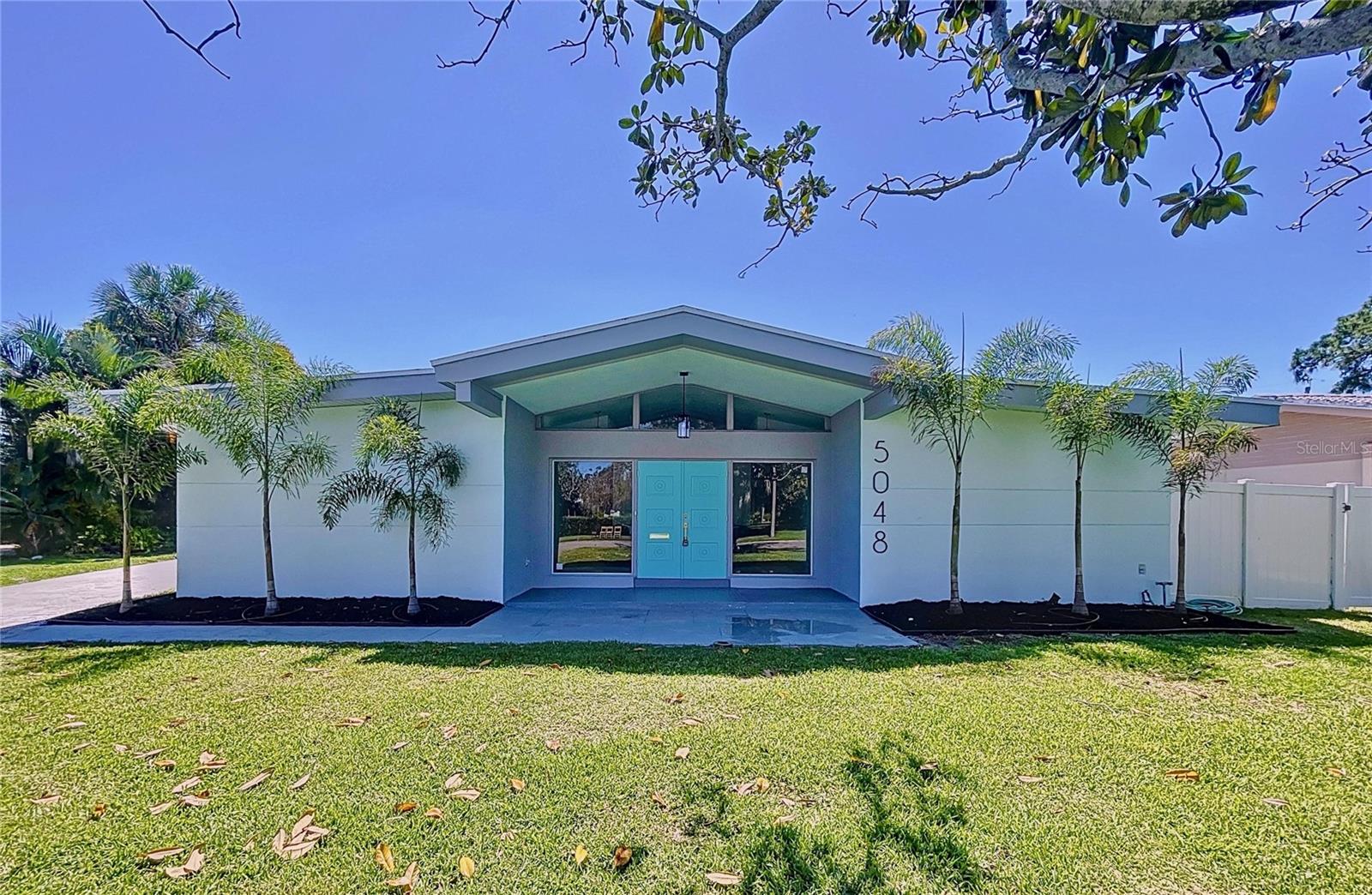 Welcome to this beautiful Mid-Century Modern home nestled in the highly sought-after Maximo Moorings neighborhood, right in the heart of the Skyway Marina District. Featuring 5 bedrooms and 3 bathrooms, this spacious residence offers an open, comfortable layout designed for both relaxation and entertaining. The split-bedroom floor plan ensures privacy for the master suite, which comes complete with a built-in closet and en-suite bath. Practical updates provide peace of mind, with a new roof and water heater installed in 2023, and an updated HVAC system from 2015. Outside, the generous driveway includes a built-in basketball court—perfect for family fun or friendly competition.
Ideally located just minutes from downtown St. Petersburg, you’ll have quick access to cultural attractions, shopping, dining, parks, and the white sand Gulf beaches. Full-service marinas, including Maximo Marina, and waterfront restaurants are nearby, making this home a true gateway to the best of Florida living. Plus, you’re just around the corner from stunning Fort De Soto Park, one of the area’s most treasured destinations.