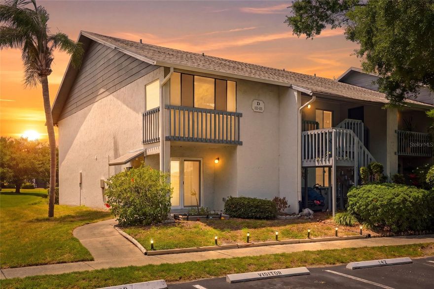 Welcome to this  all ages, beautifully maintained first-floor corner unit in the desirable Shadow Lakes community, offering 2 bedrooms, 2 baths, peaceful pond views, and the perfect blend of comfort and convenience. This highly sought-after corner unit provides added privacy, extra natural light, and easy accessibility all on the first floor.  The updated kitchen is the heart of the home, featuring modern touches and a functional layout perfect for everyday living and entertaining. Enjoy added peace of mind with double-pane windows installed in 2020, bringing energy efficiency and brightness throughout.  Both bedrooms are generously sized, offering spacious retreats with ample closet space and flexibility for guests, a home office, or seasonal living. This thoughtfully designed condo is handicap accessible, including a ramp leading outside from the second bedroom for added ease and convenience.  Relax year-round in the enclosed porch overlooking the serene pond, creating the perfect space for morning coffee or unwinding at the end of the day.  Shadow Lakes offers fantastic amenities including sparkling pools, beautifully maintained park-like grounds, and a convenient car wash station.  Ideally located near beautiful Gulf beaches, shopping, dining, medical facilities, and local parks, this condo offers the perfect Florida lifestyle with everyday convenience. Whether you're looking for a full-time residence, seasonal retreat, or investment opportunity, this one is a must-see!