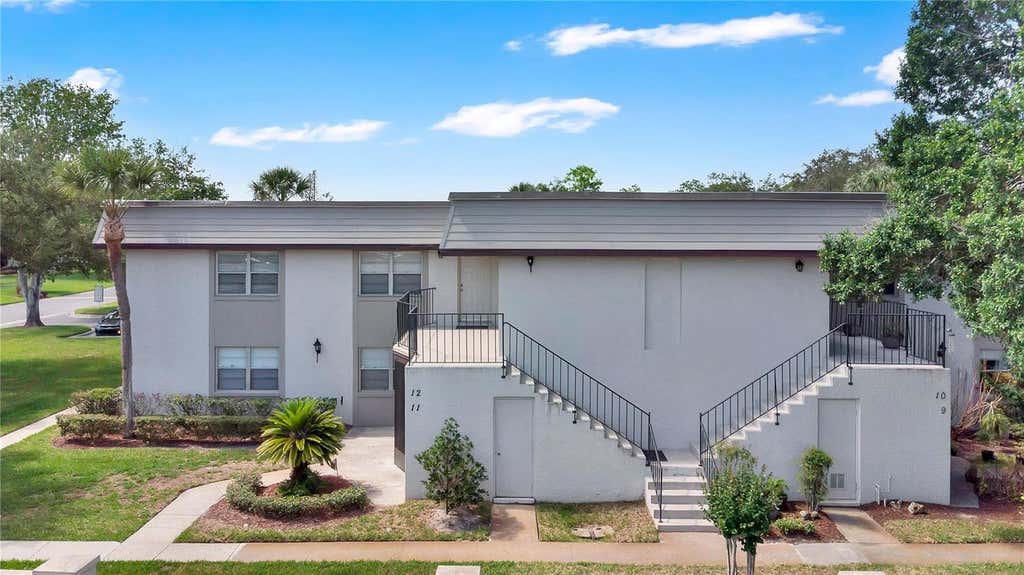 Photo of 11 Windtree Lane #B, Winter Garden, FL 34787 (MLS # O6409169)