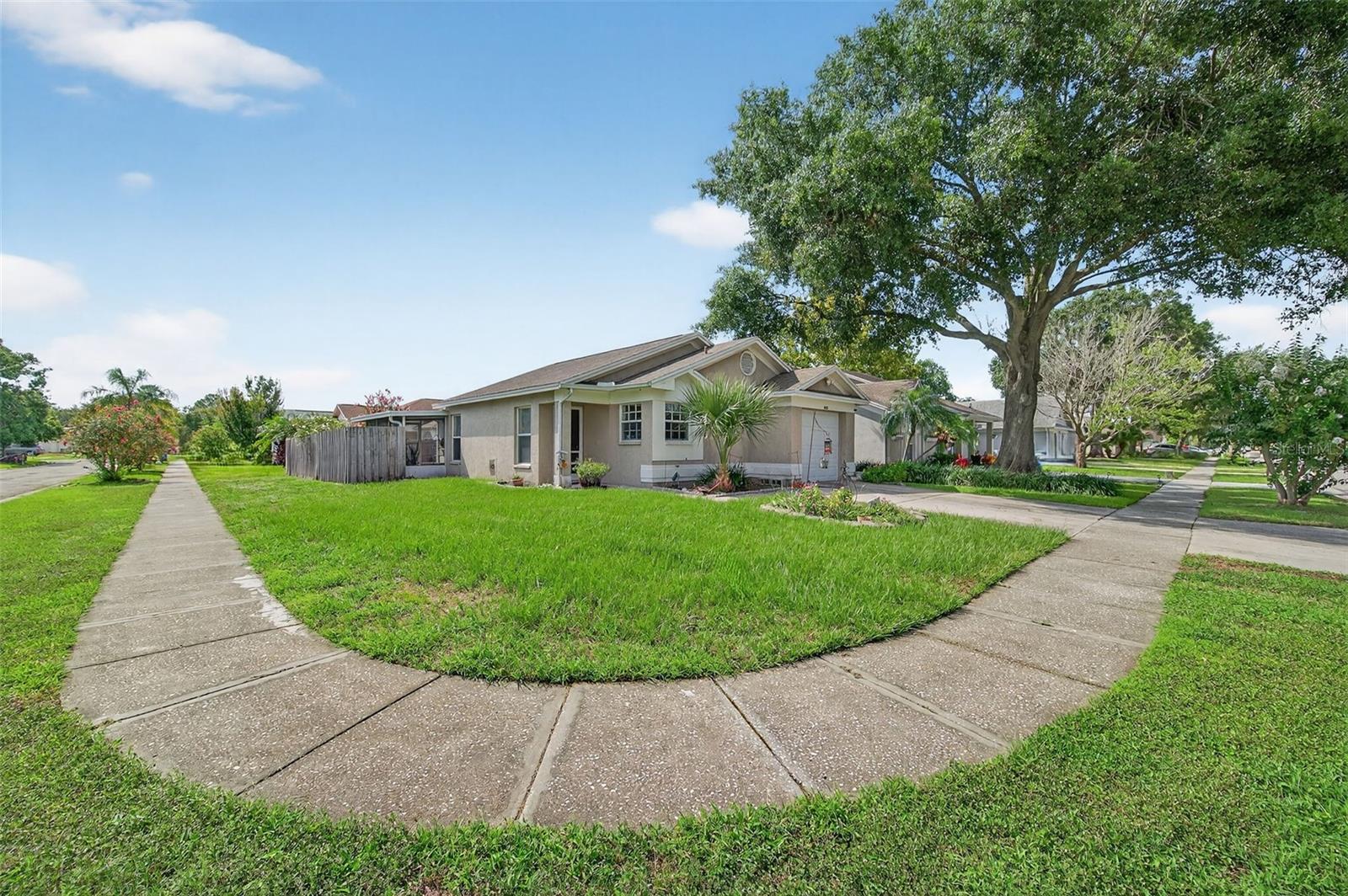 Welcome to this charming 3-bedroom, 2-bathroom home with a garage, perfectly situated on a spacious corner lot in Tampa! Step inside to find a bright and functional layout with plenty of natural light. The kitchen flows easily into the living spaces, making it great for entertaining or everyday living. The garage provides extra storage or parking convenience, while the fenced corner lot gives you added yard space for pets, gardening, or relaxing outdoors. Featuring a newer roof (2016) and an AC unit installed in 2021, this home offers peace of mind along with comfort. The location is unbeatable; just minutes from USF, Busch Gardens, the Museum of Science & Industry (MOSI), downtown, shopping, dining and major highways. The security system, cameras and even the washer and dryer convey with the sale of the home. Whether you’re looking for a primary residence or a turn-key investment property, this home makes an excellent Airbnb or long-term rental thanks to its proximity to Tampa’s top attractions.