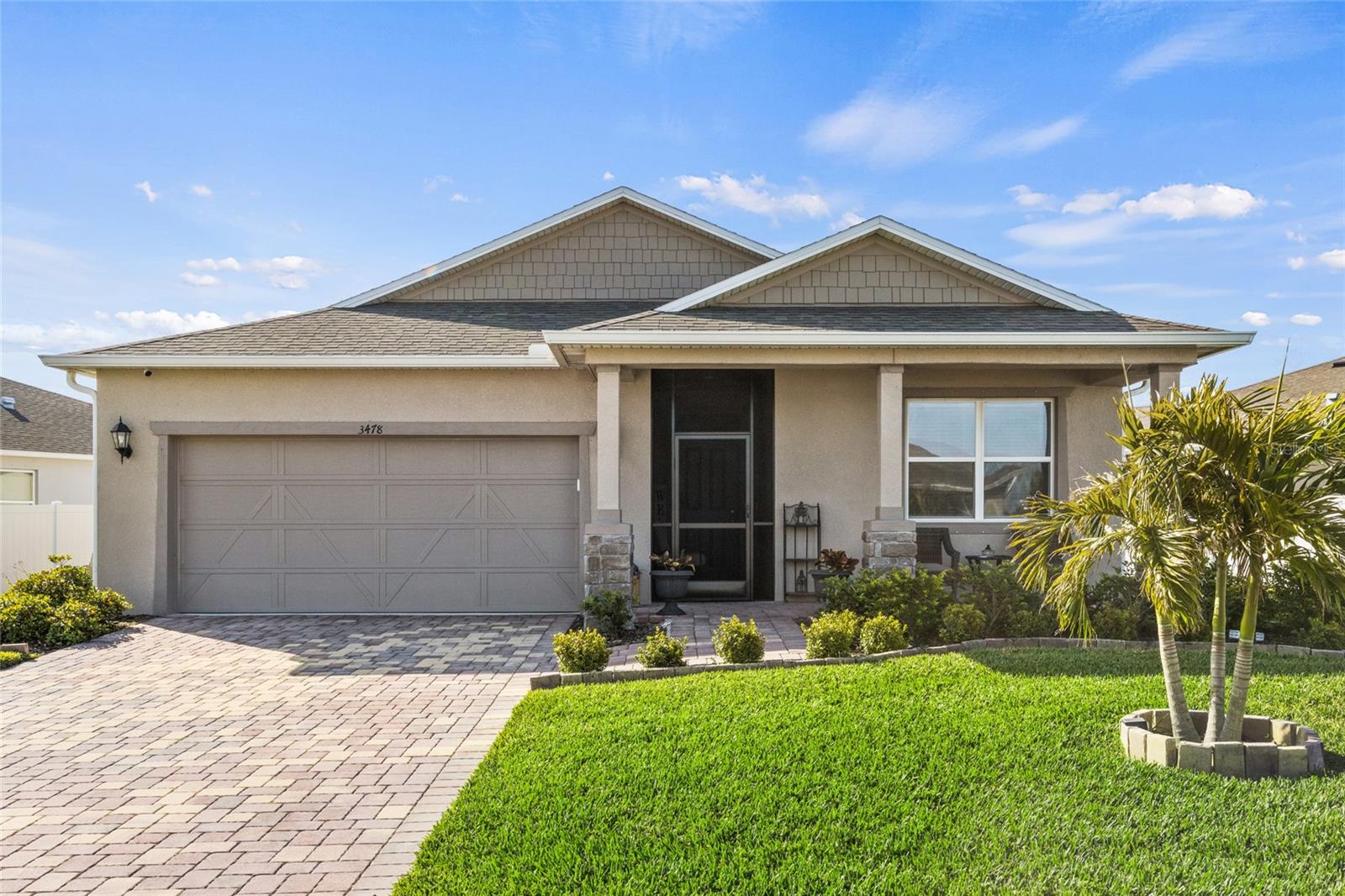 Are you ready to discover your dream home with a stunning lake view? Look no further! This stylish, move-in-ready masterpiece was built in 2022 and offers everything you desire. As you arrive, the immaculate brick paver driveway sets the tone for the exceptional care this home has received. Step inside to a thoughtfully designed open layout, where the living room, dining area, and kitchen seamlessly blend together—creating an inviting space perfect for daily life and entertaining guests. The gourmet kitchen is a true culinary haven, featuring elegant granite countertops, top-of-the-line stainless steel appliances, and a generous walk-in pantry, making it an absolute delight for any aspiring chef. The spacious owner's suite is a sanctuary, complete with a walk-in closet and a luxurious ensuite bathroom boasting dual sinks and a large walk-in shower with a comfortable ledged seat. Venture outside to your private paradise featuring a newly added pool (2023) with a sun shelf and soothing massaging jets. The captivating lake view provides the perfect backdrop for relaxation and outdoor enjoyment. Located centrally in Grady Pointe, you’ll have convenient access to parks, schools, shopping, and much more. This home truly embodies the essence of Florida living. Don’t miss your chance to make it yours—schedule your showing today!