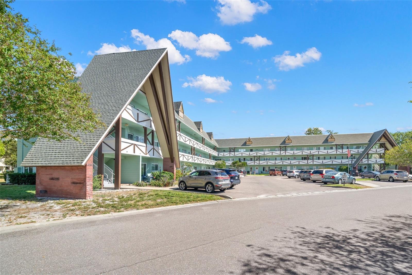 Top-Floor 2BR/2BA Condo in the Highly Desirable On Top of the World 55+ Community! Welcome home to this wonderful 2-bedroom, 2-bath unit, perfectly positioned with serene tree and courtyard views. This spacious condo offers comfortable living, modern updates, and a vibrant community lifestyle. Step through the upgraded storm door into a large, open living and dining area—ideal for hosting family and friends. Immediately off the dining space is your well-appointed kitchen featuring granite countertops, tile backsplash, stainless steel side-by-side refrigerator, microwave, and range, plus ample cabinet storage. The kitchen opens to a bright Florida room, where large windows showcase peaceful tree and courtyard views. This versatile space makes a perfect reading nook, office, or hobby area, and also offers extra closet storage. The primary suite offers a wall of closets, light-filled vanity, and a step-in shower with subway tile surround. The second bedroom is located at the front of the unit, with a large window for natural light and a generous closet. The guest bath has a tub/shower combo with an updated vanity. Additional features include laminate wood flooring in main living areas and tile flooring in kitchen and baths, and extra shelving for organized storage. The active 55+ On Top of the World community offers an incredible array of amenities, including two private golf courses (free for residents), clubhouses and pools, shuffleboard, tennis, and fitness center and a calendar full of social events and activities. This prime Clearwater location is close to shopping, dining, medical facilities, and beautiful Gulf Coast beaches. Don’t miss your chance to enjoy the Florida lifestyle in this highly sought-after community—schedule your private showing today!