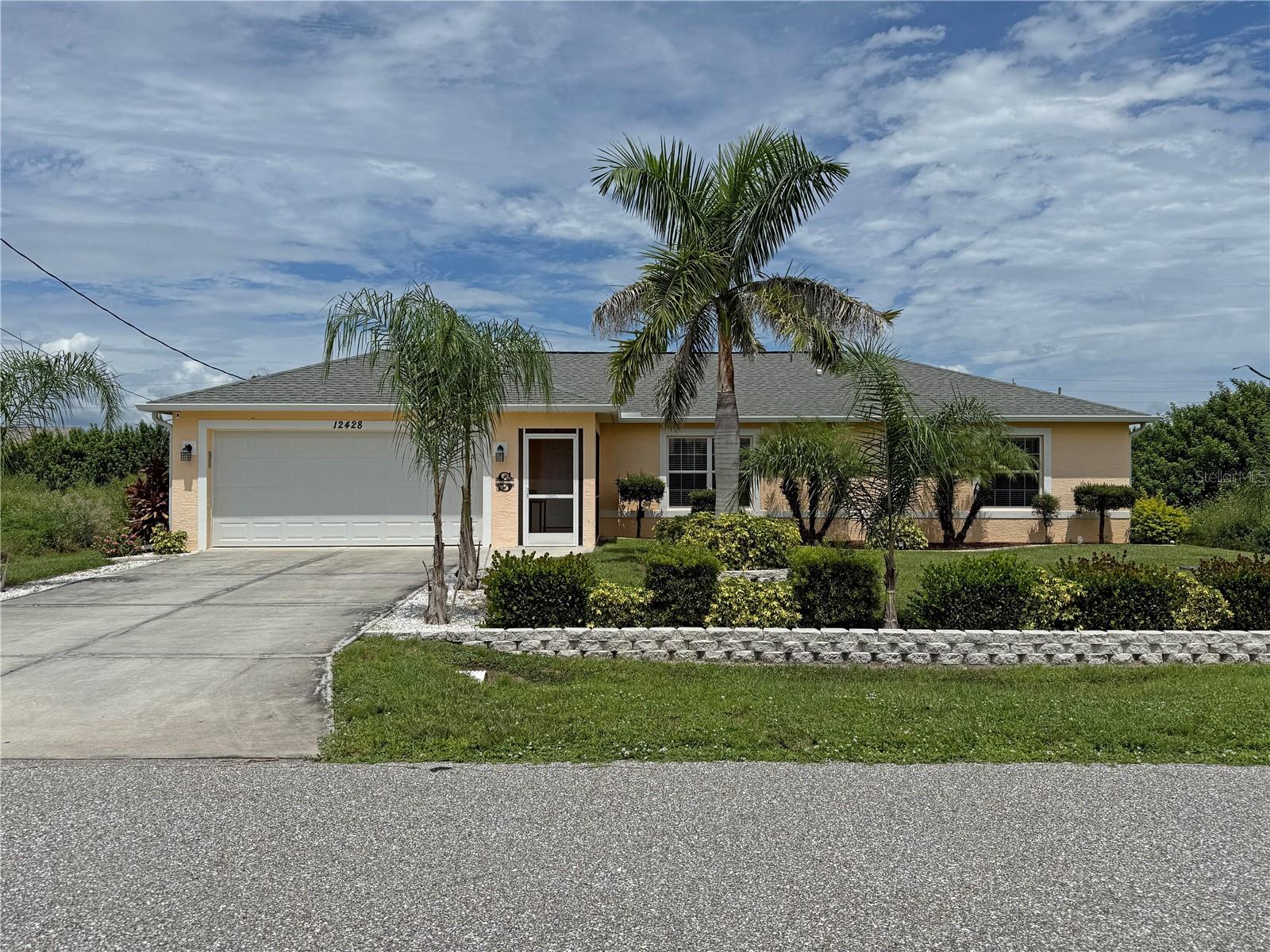 Impressive spacious home built in 2017 offers 3 Bedrooms, 2 Bathrooms and attached 2 Car Garage. This light and bright home offers an open and split bedroom floor plan with Great Room, well appointed Kitchen with Dining Area, Inside Laundry Room and screened porch. Beautiful design features throughout. The Great Room features large windows and cathedral ceiling. The kitchen offers white cabinetry, granite counters, breakfast bar, pass thru to lanai, double sink, large Dining Area and stainless appliances. Appliances include: double door refrigerator, dishwasher, oven/range, built in microwave.The Inside Laundry Room has a washer, dryer, laundry tub and storage closet. The 2 Car garage offers a door opener, attic access, side door, second refrigerator, hurricane overhead door. The spacious Master Bedroom suite has a walk in closet and private bathroom with walk in shower. There are two generous sized guest bedrooms, one with a double closet and the other with a walk in closet. The guest bathroom has a walk in shower. Your living space extends through French doors to the 16x10 screened porch with sunshades and continues to the stunningly landscaped fenced backyard. *There is also an inviting above ground POOL with crystal clear water.* Other features include rain gutters, screened front entry, privacy fence for the backyard, outdoor shower, covered patio area- perfect for griling, hurricane shutters, irrigation system, large windows, tile floors throughout. HWH replaced 6 months ago. The house faces south in the front and north in the back keeping the house cooler and your electric bills lower. Currently there are vacant lots on either side of this property. NOT in a flood zone, NO HOA and utilities are county water and sewer. This home is in a quiet neighborhood yet minutes from shopping, dining, medical care, Englewood Beach (15 minutes away).