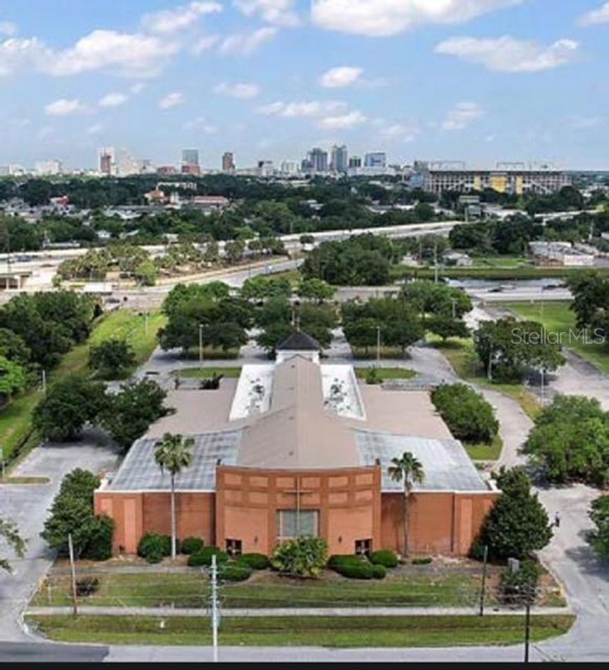 1 S Cottage Hill Rd is a rare urban redevelopment site totaling 3.86 acres and a standalone building with 30044 gross square feet that was originally built in 1976 and expanded in 2002 with the addition of offices and an events center. The existing facility has been used primarily as a fully functioning religious event center and school and includes a 1200 seat acoustic sanctuary two reception areas a full size commercial kitchen several separate kitchenettes banquet hall a boardroom a library an audio room video room meditation room media room womens and mens lounges several meeting rooms conference rooms offices classrooms storage rooms custom dividable room panels a physical fitness center and a host of restrooms. It has a separate fenced playground and paved parking for 52 vehicles and parking for 242 in total. The site provides excellent proximity visibility and access to all areas of Central Florida along the East-West Expressway/State Road 408 and US I-4 expressways and Colonial Rd/State Road 50. The SR 408 John Young Parkway eastbound exit provides direct and immediate access onto the parcel and yields direct visibility of the site while exiting. The property also features 266 ft of frontage on John Young Parkway. John Young Parkway at SR 408 has average daily traffic counts of over 48300.

Prime location off of SR 408-Included in the area are the Camping World Stadium, Exploria Soccer Stadium, and expansive redevelopment along Church St.