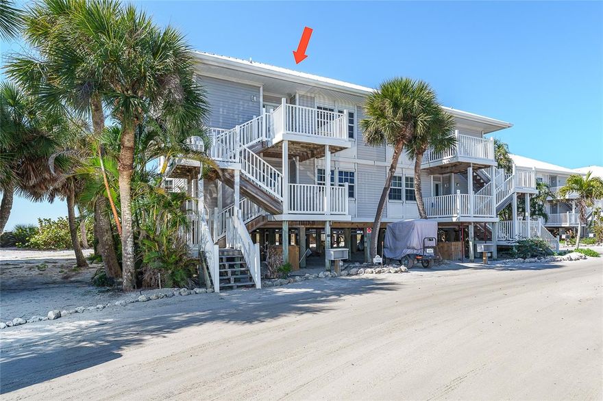 Experience the ultimate in island living with this beautifully appointed 3 bedroom, 3 bath villa with bonus room located directly on the Gulf. Elevated on pilings and framed by swaying palms, this coastal retreat offers the perfect blend of privacy, space, breathtaking views and beachfront surroundings. Inside, you’ll find a spacious floor plan designed for comfort and entertaining. The full kitchen provides ample cabinetry and workspace, flowing seamlessly into the open living and dining areas. Large windows and glass doors invite in natural light and capture serene Gulf views. Each of the three bedrooms offers comfort and privacy, while three full baths provide convenience. The versatile bonus room is ideal for a home office, media room, additional guest space, or flex area to suit your needs. Located on a barrier island between Ft. Myers and Sarasota this location is easy to get to and hard to forget. The resort style amenities are plentiful, pool, fitness, pickle ball and tennis, onsite restaurant and ice-cream shop too. Of course, the shelling and sunsets are amazing!