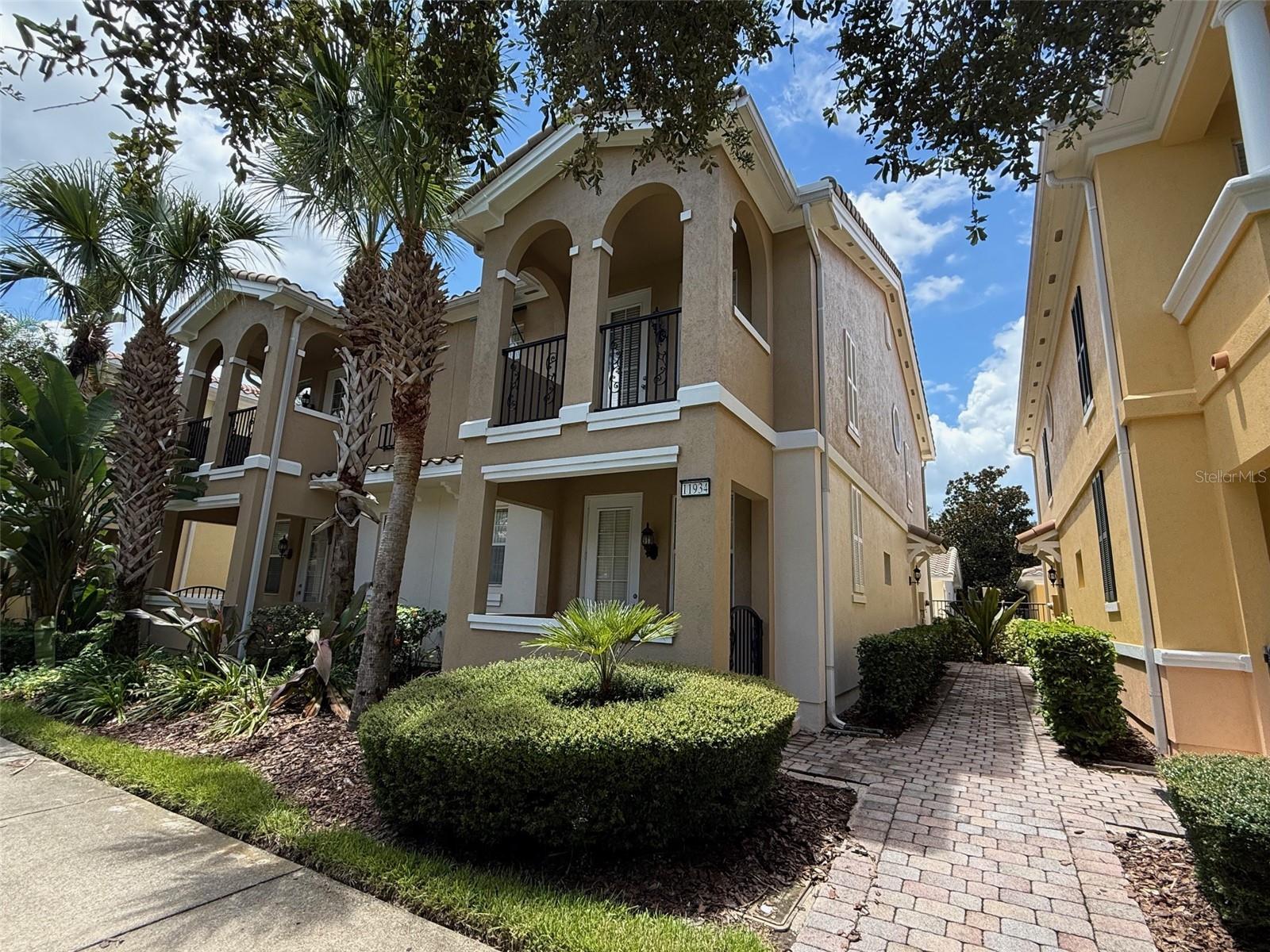 Gorgeous two-story, three-bedroom, three-bathroom end-unit townhome located in the highly desirable gated community of Village Walk at Lake Nona. This beautifully designed home features two spacious master suites upstairs, a detached two-car garage with opener, a large private rear patio, and additional private patios and balconies off two bedrooms. Custom built-in closet systems add convenience and style. Just half a block from the Town Center and amenities, residents enjoy access to a heated resort-style pool, lap pool, lighted clay tennis courts, basketball court, 24-hour state-of-the-art fitness center, scenic walking paths, and more. Ideally situated near SR 528, TR 417, the Turnpike, and I-4, Village Walk offers quick access to Orlando International Airport, Lake Nona Medical City, UCF Medical School, theme parks, shopping, dining, and top-rated schools. Rent includes basic cable, internet, and grounds care. Washer and dryer are provided. One small dog is welcome with a pet fee and monthly pet rent. Application fees apply per adult, and HOA approval is required (may take up to 20 days).Don’t miss your chance to make this exceptional townhome your new home.