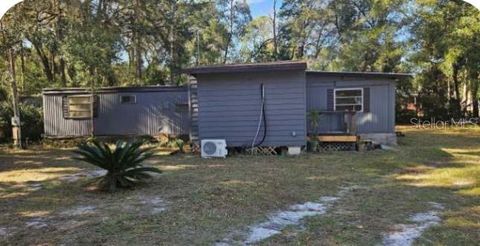 Photo of 2030 NE 117th Avenue, Silver Springs, FL 34488 (MLS # TB8472174)