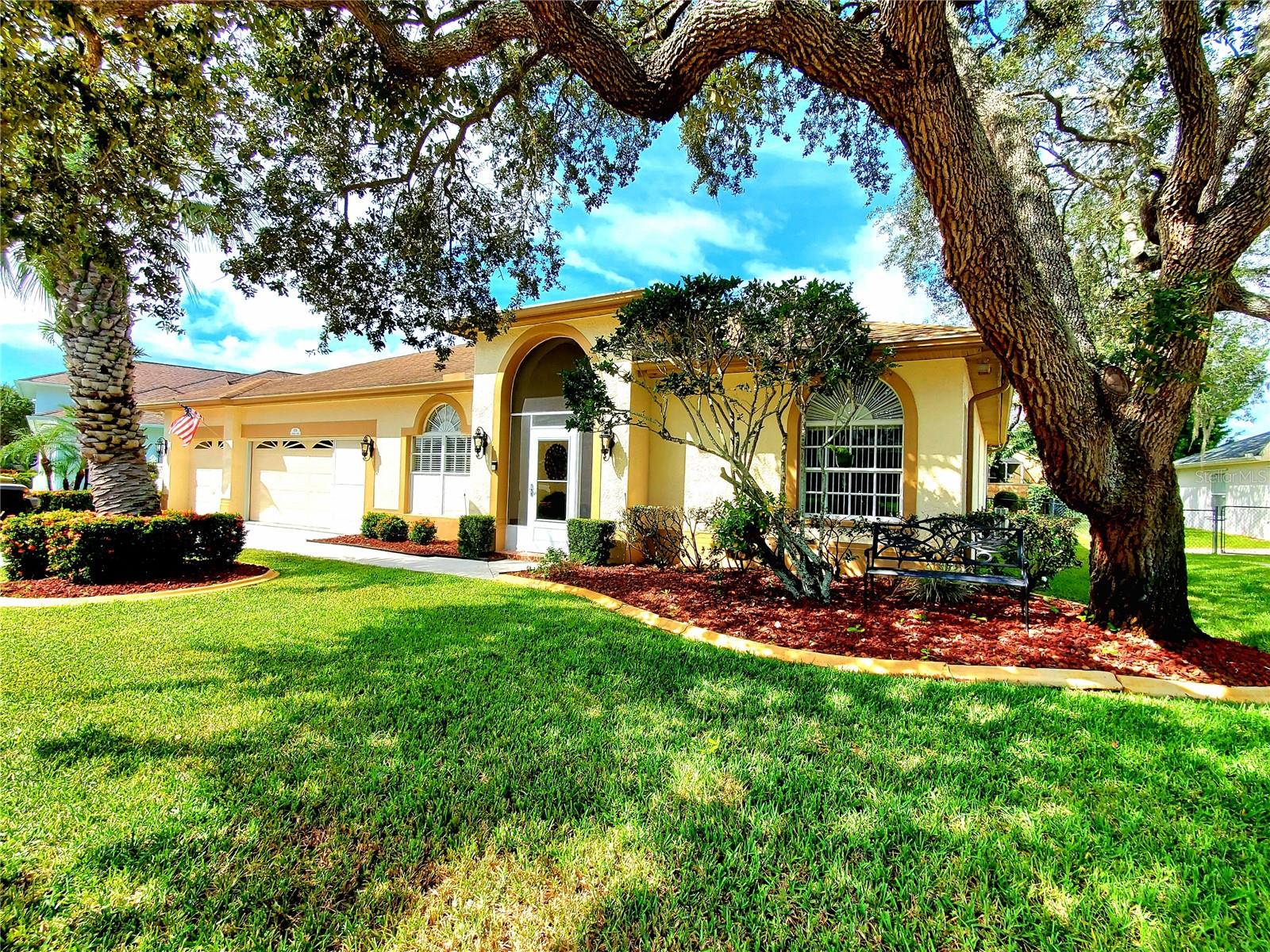 **LARGE TRINITY HOME!** Searching for a spacious house at an affordable price? Here it is! Welcoming covered front entry! This home features a traditional floor plan plus a bonus room perfect for a game room, man cave, or sunroom. The Sunroom is individually temperature controlled and is filled with natural light thanks to a wall of windows that bring the outdoors in. Step out back to a large screened patio—ideal for outdoor entertaining or relaxing. This home offers 4 true bedrooms plus a dedicated home office/library. Cherry wood floors and crown molding runs throughout the home! Enjoy separate living and family rooms, with the family room boasting a cozy fireplace. Elegant formal dining room with stunning chandelier! The kitchen includes a large island with ample bar seating, wood cabinets with new hardware, granite countertops, and stainless-steel appliances. A guest suite is tucked away in the back with convenient patio bathroom access. The master suite is spacious, featuring his-and-her walk-in closets and a luxurious bathroom. Large walk-in closet with custom built-ins for easy organizing & storage! The laundry room comes equipped with a washer/dryer, utility sink, and extra storage cabinets. The 3-car garage has an epoxy floor, storage cabinets, and shelving for all your needs. Fenced in yard for pets & play! Nestled on an oak-lined street in scenic Trinity Oaks, this home is within a short walk to all three A-rated Trinity schools! Neighborhood park & playground is just a short walk down the street! (Gas generator and irrigations system sold "as is")