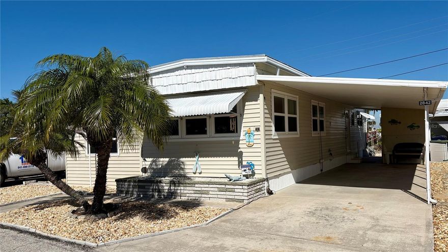 Escape to the Florida lifestyle at 2842 Trinidad Way in Palmetto! This charming 2-bedroom, 1.5-bath mobile home offers low-maintenance living that’s perfect for snowbirds or year-round  residents! Located in the desirable Tropic Isles Mobile Home Estates, a sought-after 55+ community where you own the land - NO lot rental! Enjoy NEW FLOORING throughout, creating a fresh and inviting space to relax after a day in the sun. The large enclosed lanai doubles the square footage! Highlights and updates include: all new flooring (Jan 2026), new AC ducts, new subfloor, new vapor barrier, and new underneath insulation. Home is move-in ready and sold FURNISHED (except for personal items). Just steps from Terra Ceia Bay (from your back patio) and just a short drive to the area’s beautiful Gulf beaches, plus nearby shopping and dining. A great opportunity to own your own slice of Florida sunshine—schedule your showing today!
