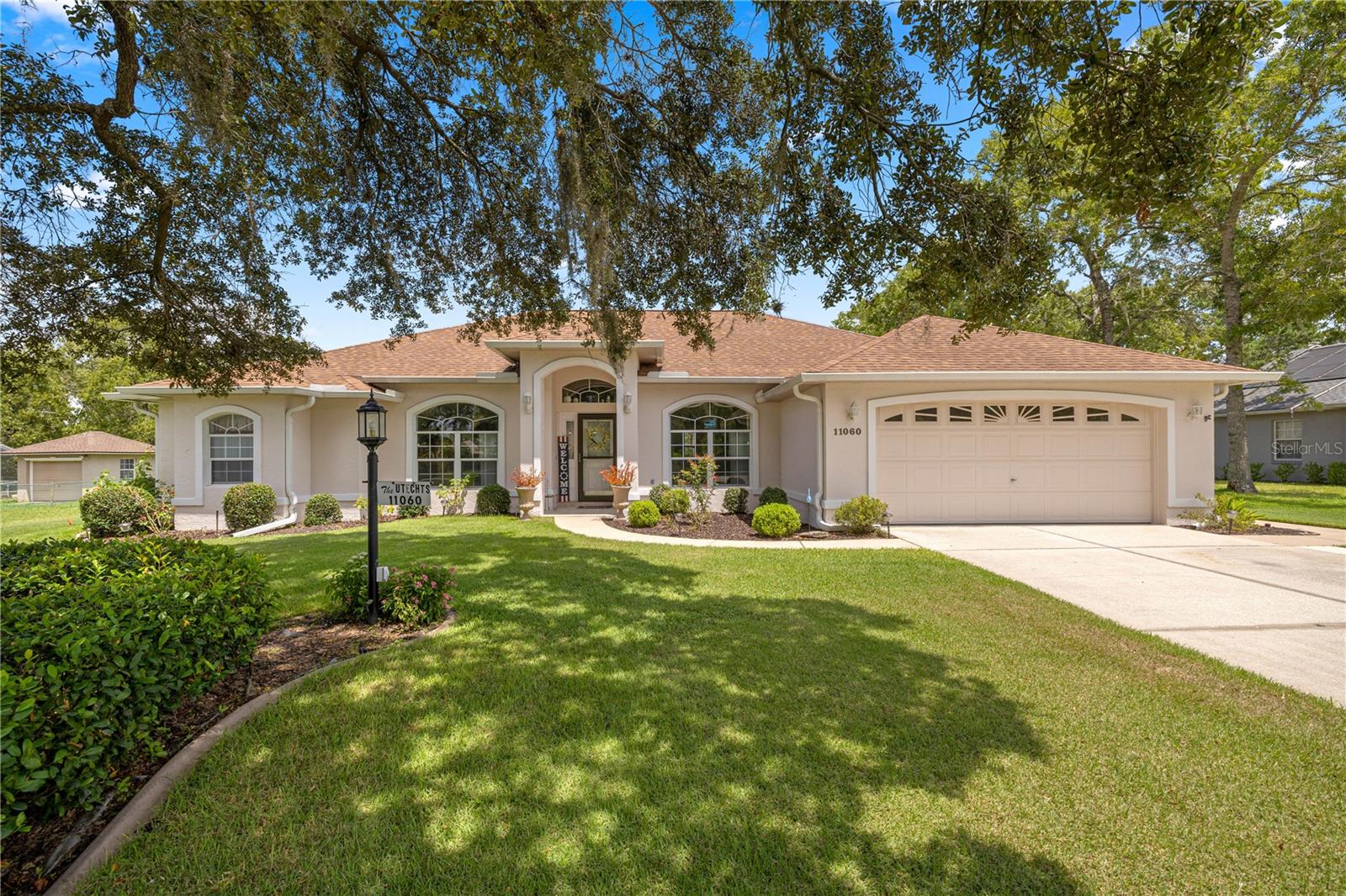 2021 ROOF! 2021 AC! 2023 WATER HEATER! 2023 SOLAR PANELS for POOL! 2023 POOL PUMP! Looking to retire to your own private oasis? This stunning pool home sits on a half-acre lot and offers 3 bedrooms plus a den, 2 bathrooms, a 2-car attached garage, and an additional 2 ½-car detached garage—perfect for extra storage, hobbies, or a workshop. Step inside to find a bright living room with vaulted ceilings that fill the space with natural light. The beautifully updated kitchen showcases new cabinets, acid-washed granite countertops, a stylish backsplash, an eat-in area, and a double-door pantry for ample storage. A spacious dining room and an additional room ideal for a home office provide versatile living options. The primary suite features an extended sitting area with slider access to the pool, a luxurious bathroom with double vanity sinks, a garden tub, walk-in closet, and extra linen storage. The split bedroom plan offers generously sized guest rooms and a full bath with plenty of closet space in the hallway.
But the true gem of this property is the outdoor retreat. The expansive screened-in pool, heated with solar for year-round enjoyment, is surrounded by a privacy screen that creates a serene, resort-like setting. With plenty of deck space for lounging, dining, or entertaining, it’s the perfect place to relax, host gatherings, and enjoy the beautifully landscaped yard. Close to shopping, restaurants, hospitals, and short distance to the World Equestrian Center. Don't miss this opportunity and make your appointment today. Furniture negotiable.
