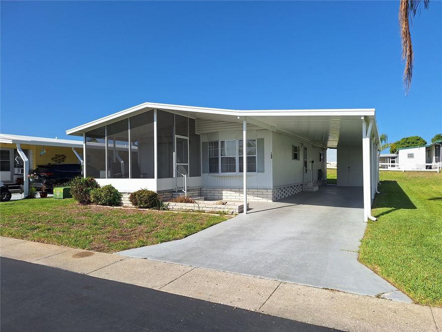 Stonehedge on the Hill is a resident-owned, 55+ mobile home community located close to shopping and restaurants in Downtown Tarpon Springs. NO LOT RENT! The roof-over on this 2 bedroom, 2 bath home is two years old. The carport was also replaced in 2024. Most of the flooring was replaced eight years ago and the floor in the primary bedroom is one year old. With some additional interior updating, this could be your perfect retirement home! Some furniture will stay. Stonehedge is a beautifully maintained, golf cart friendly community, featuring a heated pool with sun deck, shuffleboard courts, a pavilion for residents to gather, a clubhouse with a full kitchen, a billiard/game room and a library. The low HOA fee of $380/month includes escrow reserves funds, maintenance of common areas and roads, cable, internet, lawn maintenance, exterior pest control, water, sewer, trash/recycling, irrigation system and on-site management. With nearby golf courses, local beaches, the Pinellas bike trail, the Sponge Docks and Downtown Tarpon Springs, this is the perfect retirement community where you can be as active as you like or just relax by the pool. Don't delay - make an appointment today!