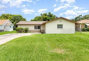 Centrally located in St Cloud in a quiet subdivision and literally 5 blocks away from East Lake complete with walking and jogging trails, playgrounds, marina and restaurant. East Lake can be seen looking North down the road in front of the home. Close and easy access to all things in St Cloud, Kissimmee, Lake Nona and Narcoossee. New roof and gutters in front and back of this home in January 26, 2017 for any insurance concerns. The rear yard is chain linked fenced. There is also a electric stub up 15' away from the 29' 9" X 10' roofed and screened patio in the back yard for a previous above ground pool. The garage is has a courtyard entry and is 16' X 21' 5" with a Laundry pad that is 10' 8" X 4' 7' complete with a mop sink and your washer and dryer hook ups. The garage also has a rear pedestrian door to the side yard and in addition there is a separate room in the garage for a toilet and has the toilet flange already in the floor and water supply. This home is livable and has the original kitchen and bathrooms and is suitable for a remodel either on your own terms or 203K FHA or conventional remodel financing.