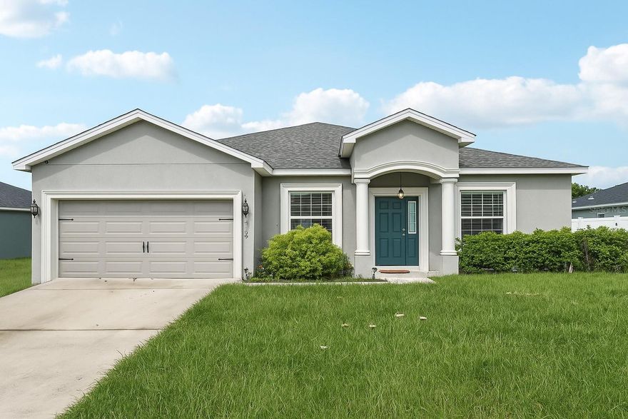 One or more photo(s) has been virtually staged. Nestled in the serene community of Eagle Lake in Polk County, this 2,040 sq ft one-story home offers four bedrooms, three baths, and an inviting open living area perfect for everyday living. The kitchen features white shaker-style cabinets, Samsung stainless steel appliances, a pantry, breakfast bar, and a versatile dining room, while the living areas, baths, and laundry include stylish wood vinyl plank flooring with cozy carpet in the bedrooms. The owner’s suite is a true retreat with a tray ceiling, a walk-in closet, and a spa-like bath with dual sinks and a decorative tiled shower with a glass enclosure. Outdoor living shines here too, with a welcoming front porch and a spacious covered lanai for relaxing or entertaining. Additional thoughtful features include a two-car garage, custom-fit window blinds, architectural shingles, and energy-efficient insulation and windows. Just minutes from the Eagle Lake boat ramp and park, and a short drive to LegoLand, the home is also centrally located between Tampa and Orlando, making it easy to reach theme parks and beaches. Within 20 minutes, you can be in downtown Winter Haven, downtown Bartow, or South Lakeland. Come experience the Central Florida lifestyle and schedule your showing today!