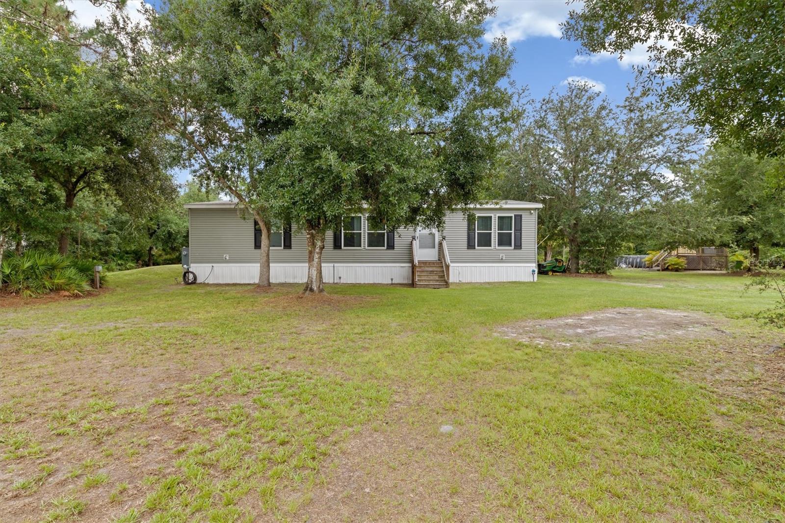 Discover your private retreat in the heart of Florida! This charming 3-bedroom, 2-bath home sits on 4.8 gated, wooded acres in a fabulous Arcadia location — offering space, privacy, and flexibility for the lifestyle you’ve been dreaming of. The home features a spacious layout with a split floor plan and a large kitchen perfect for cooking and gathering.
Step outside to a generous back deck and patio, ideal for entertaining or relaxing under the stars. Cool off in the above-ground pool, and enjoy the added bonus of a separate guest mini home/trailer — perfect for extended family, visitors, or potential rental income.
This property welcomes horses and farm animals, surrounded by beautiful trees and nature for peaceful country living.
Located in one of Florida’s best-kept secrets — Arcadia — known for its historic downtown, top-rated antique markets, and the famous Granddaddy of 'Em All Rodeo. In less than 30 minutes, you can be on I-75 with quick access to Ft. Myers, Sarasota, and countless Gulf Coast beaches. The Punta Gorda Airport is nearby too, offering a variety of convenient flight options.
Don’t miss this rare opportunity to own a unique slice of Florida paradise!