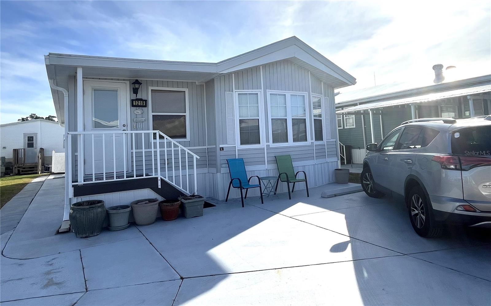 WELL KEPT CHARIOT MOBILE HOME IN ACTIVE 55+ COMMUNITY! One bedroom, 1 1/2 bath turn-key home. There is a comfy living room, family room, & eat-in kitchen with built-in storage. Home has a beachy cottage feel. Unique drapery installation allows family room with sofa bed to be enclosed, providing privacy for overnight guests. Beyond the drapes is a bonus area which could be used as a small office, extra storage, or a craft area. All appliances included. Inside laundry. The bedroom has built-in storage, a vanity area, and an en suite bathroom with tub/shower. Central A/C (2014). Membrane roofover (2019). All the plumbing was updated in 2013. Priced to sell – move in ready – just bring your clothes and food! SUGAR CREEK COUNTRY CLUB CO-OP HAS LOW HOA FEES of just $525 quarterly which includes water, trash, sewer, basic cable, internet, and grass mowing. There is an active social calendar with fun activities and outings during the winter months. Enjoy this community's proximity to the Braden River and River Links Golf Course. Sorry this is not a dog lot.