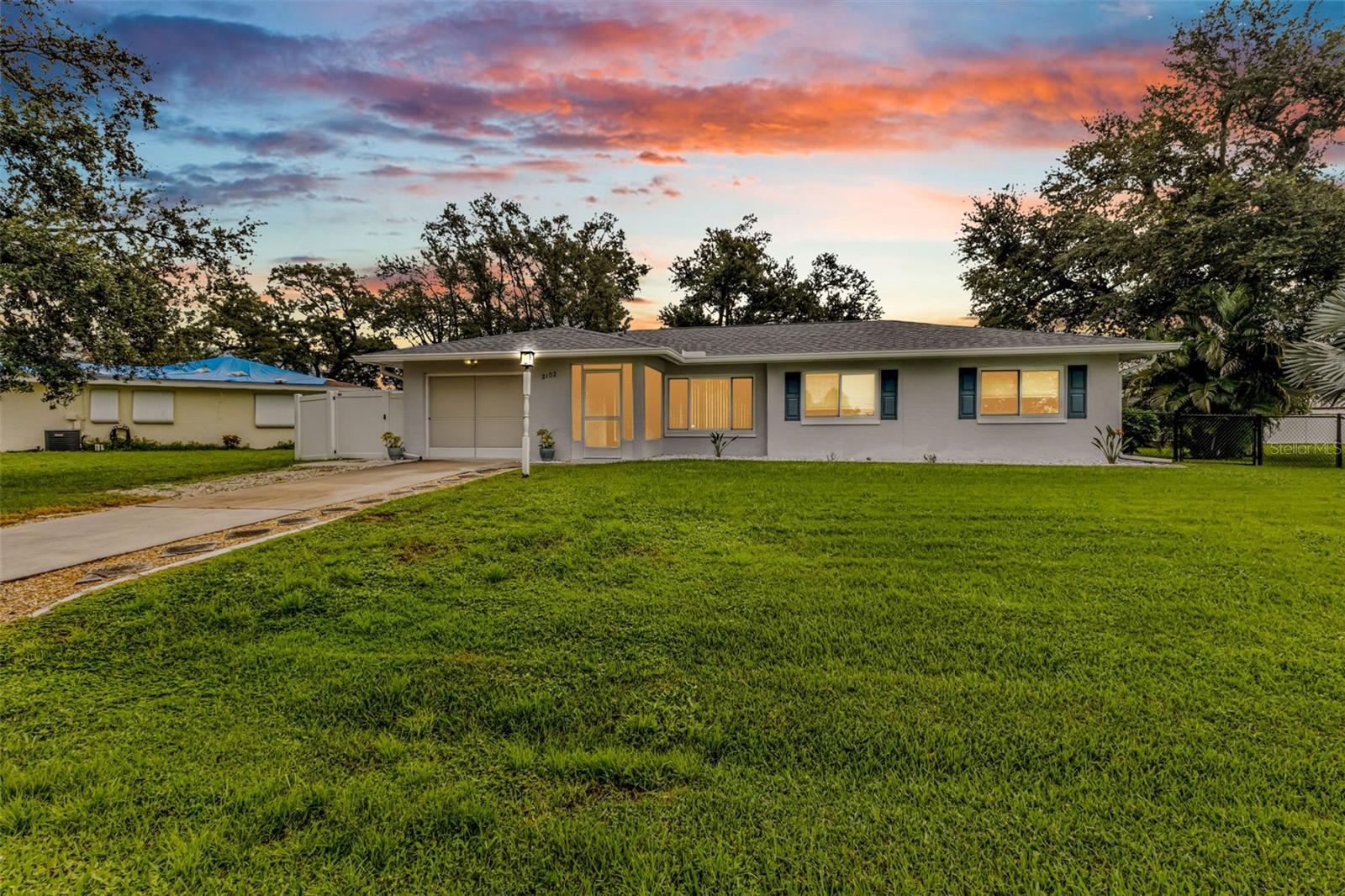Discover this fully updated, move-in ready pool home in Port Charlotte with No HOA and in Flood Zone X. Impact windows & doors were installed in 2017, New Roof (2024), New Hurricane Impact Garage Door (2019), New Pool Heat Pump (2018), Updated Electric Panel Box to 200 AMP (2015). 10' x 16' Shed (2019). This property incudes a completely fenced double lot, room for pets and plenty of space for your boat or RV. Step inside and you are greeted by a spacious living area filled with natural light and easy-care tile flooring, and as you walked toward the dining room, you will find the heart of this home is the stunning, fully remodeled kitchen with granite countertops, stainless steel appliances, beautiful cabinets with soft close drawers/doors and so many pull out shelves - perfect for anyone who loves to cook or entertain. All 3 bedrooms are down the same hallway with luxury vinyl planking flooring, nice sized closets and fans in each room. Both the primary en-suite bathroom and the hallway bathrooms, have been updated with new cabinets and toilets. As you exit the home from the dining room through the impact sliding glass doors you will walk onto the 10' x 22' covered lanai and see the heated pool equipped with solar cover, lighting and screen enclosure. Picture year round gatherings, pool parties, or simply relaxing in your own back yard oasis. This location is all about convenience, you're close to shopping, dining, medical centers, top-rated schools, and easy access to I-75 for commuters or weekend getaways. With no flood insurance required and every feature today's buyers want, this home is truly move-in ready and waiting for the right owner to enjoy! Schedule a private tour today and experience the Florida freedom lifestyle you've been dreaming of - right here at 2102 Alaric St., Port Charlotte.