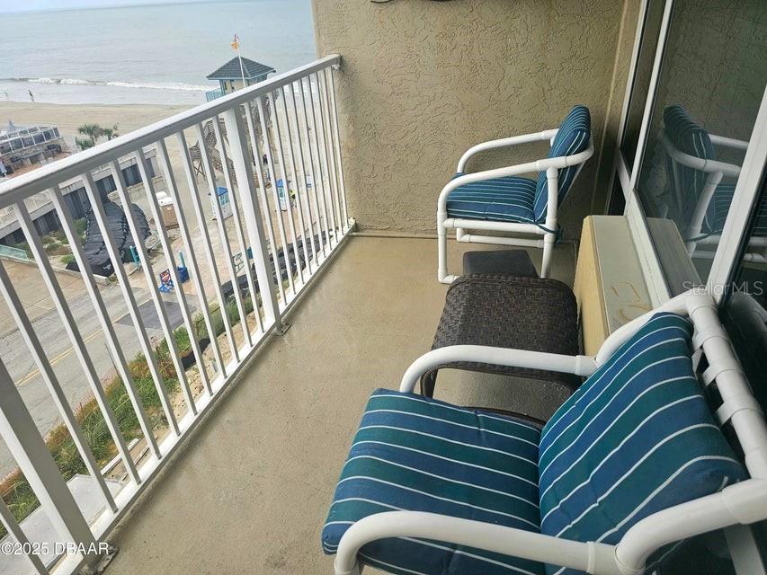 Lovely unit with a private balcony overlooking the ocean and the river. Enjoy the sunrise and the sunset from the comfort of your unit. Nicely updated. vinyl flooring, kitchen area, paint and bathroom. It is nicely staged with elegant furniture. King Size bed, big, curved screen TV and TV stand. Everything you see is included in the sale. New AC unit. Use this unit for your enjoyment or make it a lucrative investment property. No restrictions on rentals. Short term & long-term rentals are allowed. Perfect location being close to restaurants and to the pier and all of Daytona attractions. Enjoy the many special events that Daytona brings all year round. (Race week, bike week, Spring break, Turkey Rod Run, Oktoberfest fest and more). Pool work in progress, estimated completion by end of July 2025. Don't miss out on this unit. Contact me to schedule a viewing.