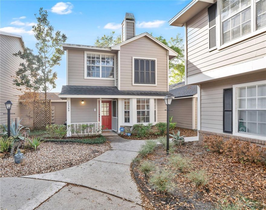 Welcome home to Thatcher's Landing! This beautifully maintained, MOVE-IN READY condo is waiting for its next lucky owner! As you step inside the home, you'll see the open kitchen layout featuring stainless steel appliances, solid wood cabinets, and solid countertops. A window seat adds a cozy touch, while the convenient serving hatch overlooking the living and dining area keeps the space connected and perfect for entertaining. There's a half bath downstairs that adds everyday practicality. The spacious living room flows seamlessly to your screen-enclosed patio through glass sliding doors, your private retreat complete with a ceiling fan, ideal for enjoying those beautiful Florida evenings. Head upstairs and discover two generously sized bedrooms, each with its own ensuite bathroom! The primary bedroom has a cozy fireplace, making it the perfect place to unwind at the end of the day. This home is nestled in a prime location near top-rated schools, Waterford Lakes Town Center, and an abundance of shopping and dining options, with quick, easy access to FL-408 and FL-417 for stress-free commuting. Whether you're a first-time buyer, downsizing, or simply looking for low-maintenance Florida living at its finest — this one is a must-see! Don't miss your opportunity, schedule your private showing TODAY!