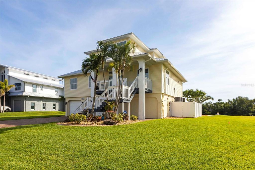Photo of 24197 Treasure Island Blvd. Blvd, Punta Gorda, FL 33955 (MLS # TB8389876)