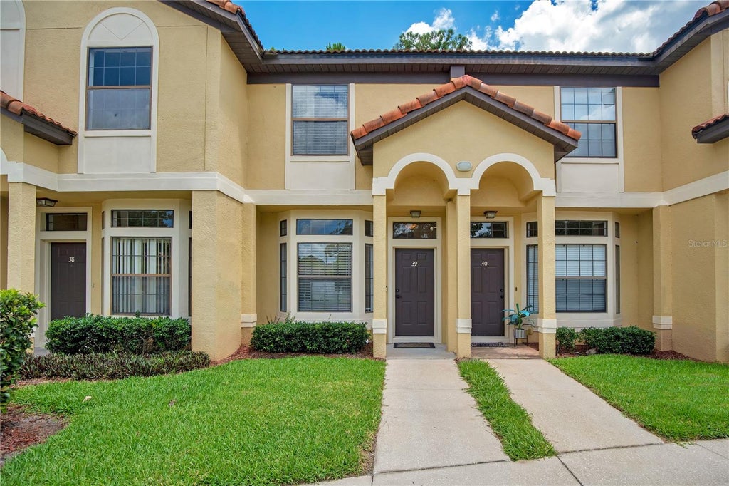 Photo of 6007 Scotchwood Glen #39, Orlando, FL 32822 (MLS # O6416271)