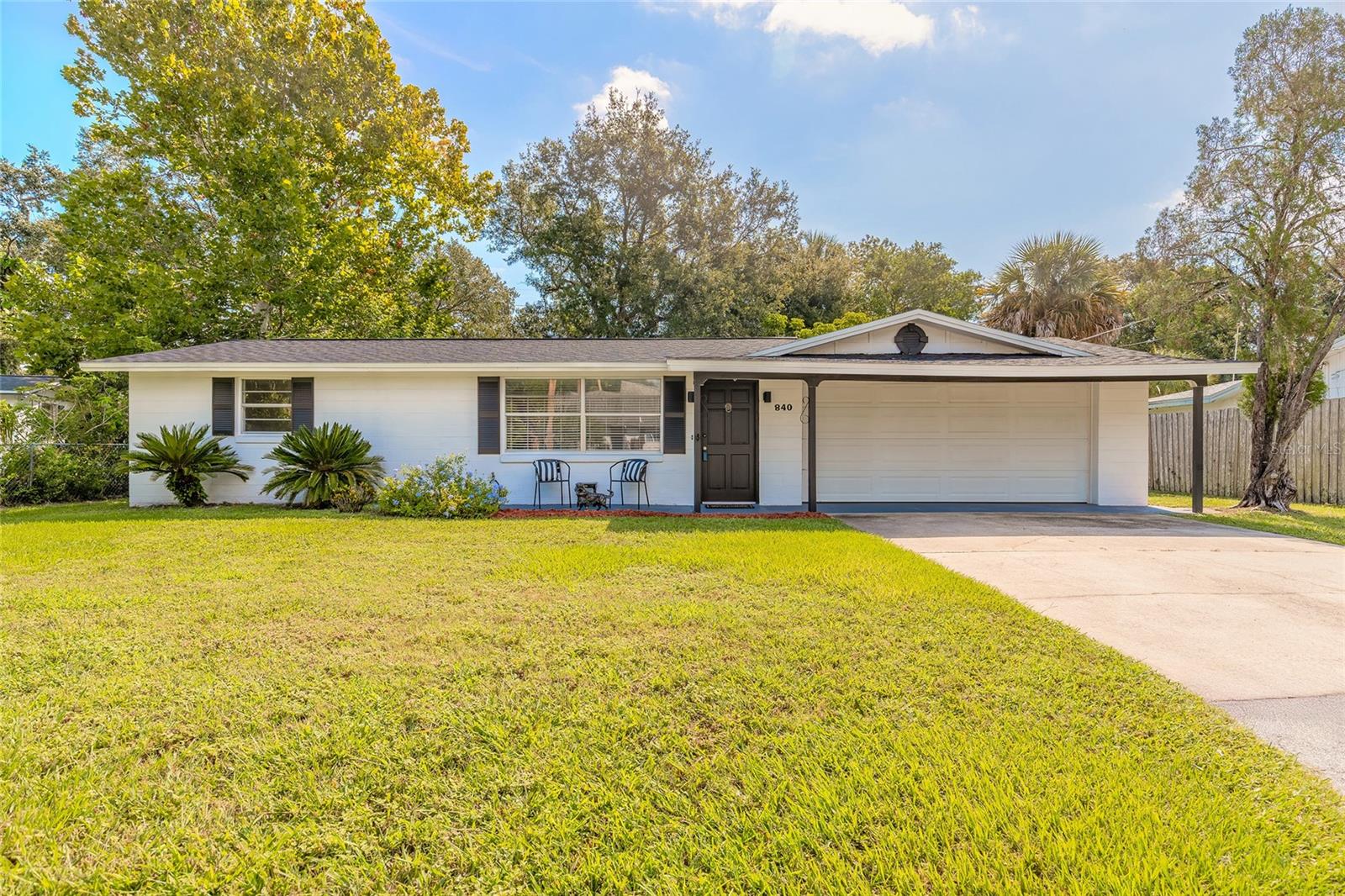 This beautifully updated 2-bedroom, 1.5-bath home offers comfort, convenience, and charm. Step inside to find two spacious living areas, a glassed-in Florida room, and a remodeled kitchen and baths with modern finishes. The interior and exterior have been freshly painted, paired with new laminate flooring throughout. Major upgrades include a brand-new roof, updated electric with new panel, and a new water heater—giving you peace of mind for years to come. The 2-car garage includes a workshop, plus there's a shed for extra storage. Ideally located near an Sugarmill Elementary and the Port Orange Riverwalk Park, where you'll enjoy playgrounds, splash pad, picnic spots with grills, and kayak rentals with launch access. Move-in ready and close to everything you need—don't miss this one!