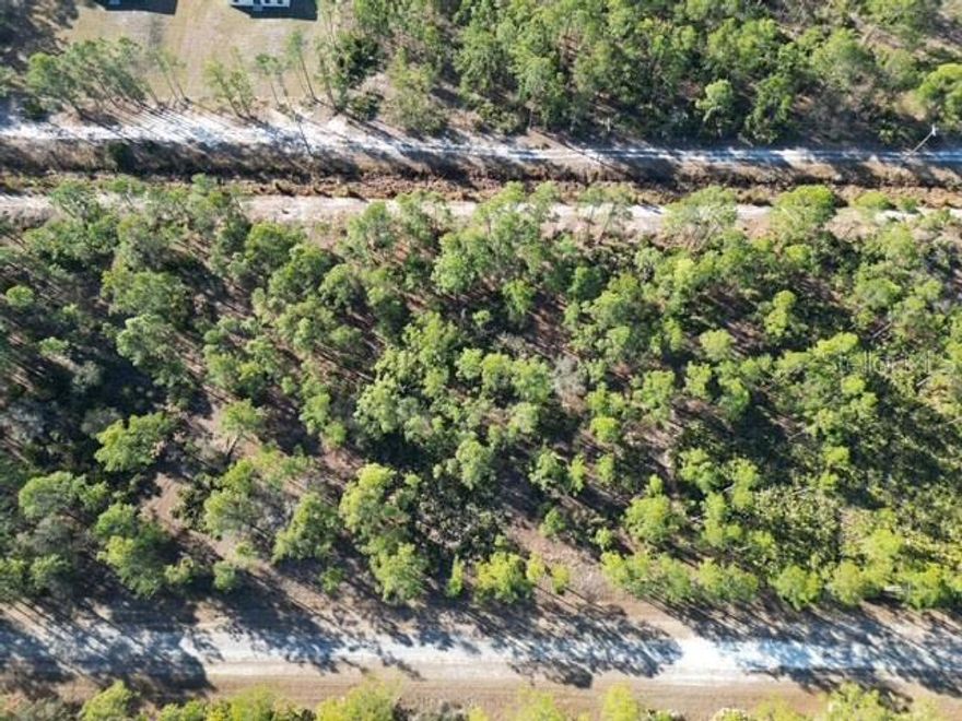 Build your Florida dream home on this spacious lot in the lake and golf community of Indian Lake Estates. With plenty of room to design your ideal home, this property offers privacy and flexibility while still enjoying access to outstanding community amenities. Residents have access to Lake Walk-In-Water, a 7,500+ acre lake known for exceptional bass fishing, along with a private marina, boat ramp, clubhouse, fitness center, tennis courts, and an 18-hole golf course.

Rare opportunity: The adjacent lot is also available for purchase. Side-by-side parcels are seldom offered at the same time — secure both before one sells and the opportunity is gone. Owning both provides expanded space, enhanced privacy, and flexibility for a larger estate-style build or future investment.