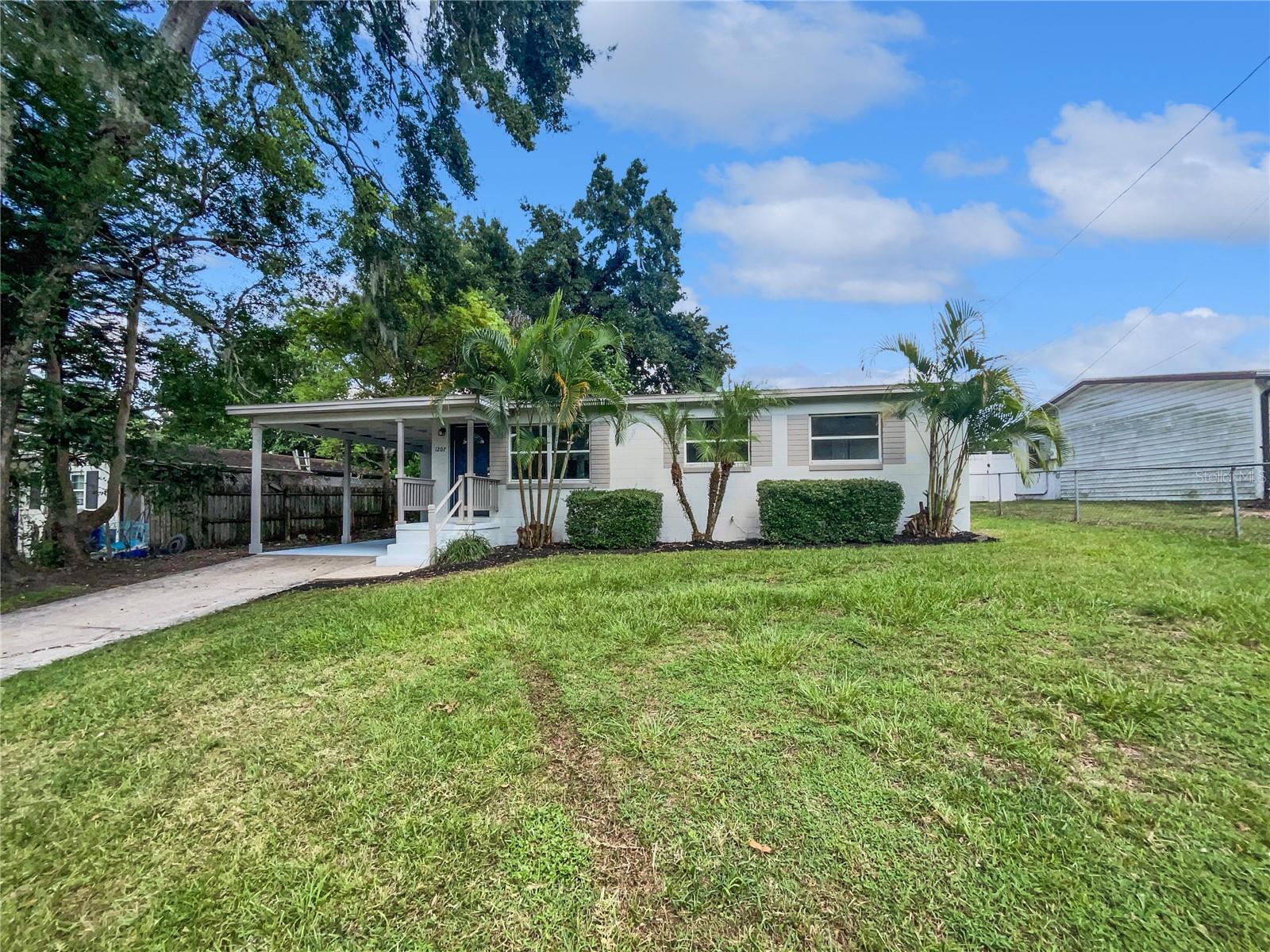 One or more photo(s) has been virtually staged. “Bear Lake Hills Home – Lake Brantley Schools & Bear Lake Access Around the Corner!”
Charming 3BR/1.5BA home in sought-after Bear Lake Hills, zoned for top-rated Lake Brantley High School! This move-in ready residence offers over 1,000 sq. ft. of living space with durable luxury vinyl flooring throughout most areas. The updated kitchen features granite countertops and stainless steel appliances, perfect for everyday meals or entertaining. An inside laundry room adds convenience, and an enclosed Florida Room provides extra space for relaxing or gatherings. Enjoy a large fenced backyard with mature trees for privacy and shade. Just around the corner is public access to Bear Lake—ideal for boating, fishing, and water sports. Conveniently located near shopping, dining, theme parks, major roadways, and the airport. This well-maintained home combines comfort, location, and lifestyle in a welcoming community with exceptional schools. Don’t miss this opportunity!
