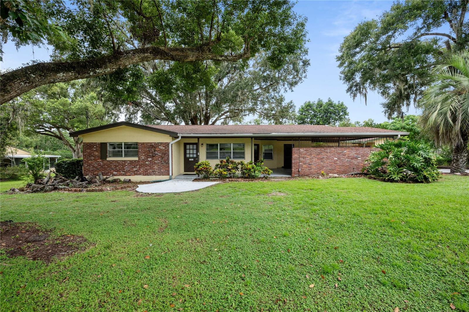 Welcome to this rare 4-bedroom, 3-bathroom home situated on a spacious .88-acre lot in the heart of downtown Dade City WITH A GUEST HOUSE! Blending comfort, convenience, and character, this property offers the rare combination of a main residence plus a detached in-law suite/guest house—perfect for extended family, visiting guests, or even rental income opportunities. The main home features an inviting floor plan with light-filled living spaces, a generous kitchen, and multiple gathering areas designed for both everyday living and entertaining. The bedrooms are well-appointed, with the primary suite offering a private retreat complete with its own ensuite bath.
Step outside and enjoy the serene setting on nearly an acre of land, shaded by mature trees and surrounded by landscaped grounds—ideal for gardening, play, or simply relaxing in your own private oasis. The detached guest house/in-law suite has been completely remodeled and offers a fully self-contained living space with its own entrance, ensuring privacy and flexibility for multigenerational living or hosting guests.
Located just minutes from downtown Dade City’s charming shops, local restaurants, and historic streets, this home provides a unique opportunity to enjoy small-town living while still being close to all modern conveniences.