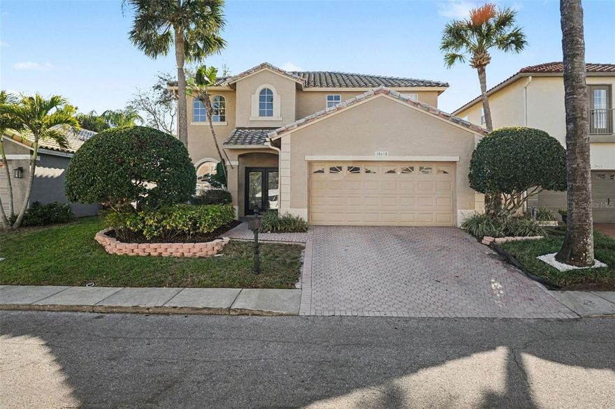 We are excited to present this Mediterranean pool home located in the gated community of Palm Bay at Bayside. This exceptional three-bedroom, two-and-a-half-bathroom residence offers a premier waterfront lifestyle with Bay and Gulf access through the community marina, providing all the benefits of a boating community. The home features a thoughtful layout with the master suite located downstairs, boasting a garden bathtub, separate shower, and a walk-in closet with custom organizers. The interior is highlighted by a formal living room with 20-foot ceilings and designer chandeliers, complemented by custom wood stairs and wrought iron railings leading to a versatile upstairs loft. The kitchen is well-appointed with stainless steel appliances, granite countertops, and a breakfast bar that opens to the family room. Outside, the property includes a covered screened lanai, soothing waterfall pool with a beach entry, and an extended paver deck, perfect for entertaining. Notable upgrades and features include a one-year-old HVAC system and the peace of mind that the home remained high and dry following Hurricane Helena. The Palm Bay community also offers a private boat ramp, tennis courts, a playground, basketball courts, and a dog park. This is a must-see for anyone looking for high-end features and waterfront access.