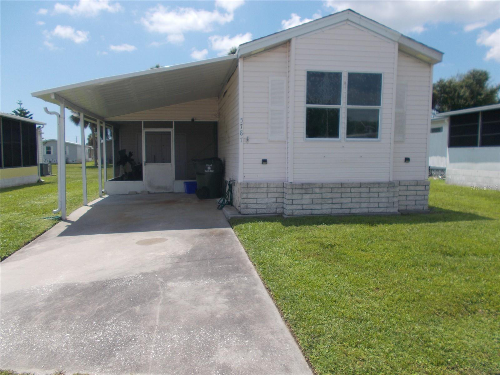 This is a 2 bedroom 2 bath unfurnished Single wide 14 foot home in the 55+ Gated Community of Holiday Park and in the PET SECTION. This home is in need of TLC. This home was built in 1995 and is 791 under air. As per county records the roof was installed in 2011 and AC in 2010. It is a split floor plan with the Master Bedroom in the back. It has a 9 X 11 screened Lanai and an enclosed Lanai which measures 12 X 17. It also has an 8 x 8 shed. It is a short walk to the clubhouse and pool. In Holiday Park you own the land with a deed and your monthly maintenance charge of $195.00 ($2340.00 a year) is included in your taxes. This community features 2 clubhouses, 2 swimming pools, a library, a fitness room, tennis courts, pickleball and Bocce to name a few. You are close to dining, entertainment, numerous golf courses, sport facilities and SW Florida's renowned beaches. If you are handy, this is the place for you!