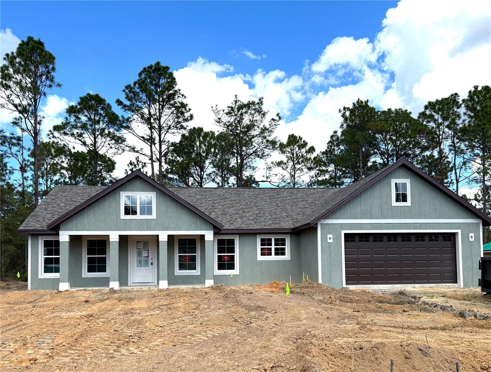 Under Construction. Move in before Christmas!  This beautiful brand-new home in the popular community of Citrus Springs, where you can enjoy the freedom of NO HOA. Step inside to discover a spacious, split floor plan designed for modern living. The heart of the home is an open-concept kitchen, boasting a large center island, gleaming quartz countertops and upgraded cabinets. A huge walk-in pantry provides ample storage. The luxurious vinyl plank flooring extends throughout the main living areas, creating a seamless and modern feel. The baths feature tasteful tile and beautiful quartz countertops, adding to the home's fresh and polished appeal. With upgraded finishes and a welcoming, thoughtful layout, this is the perfect space for entertaining family and friends.
