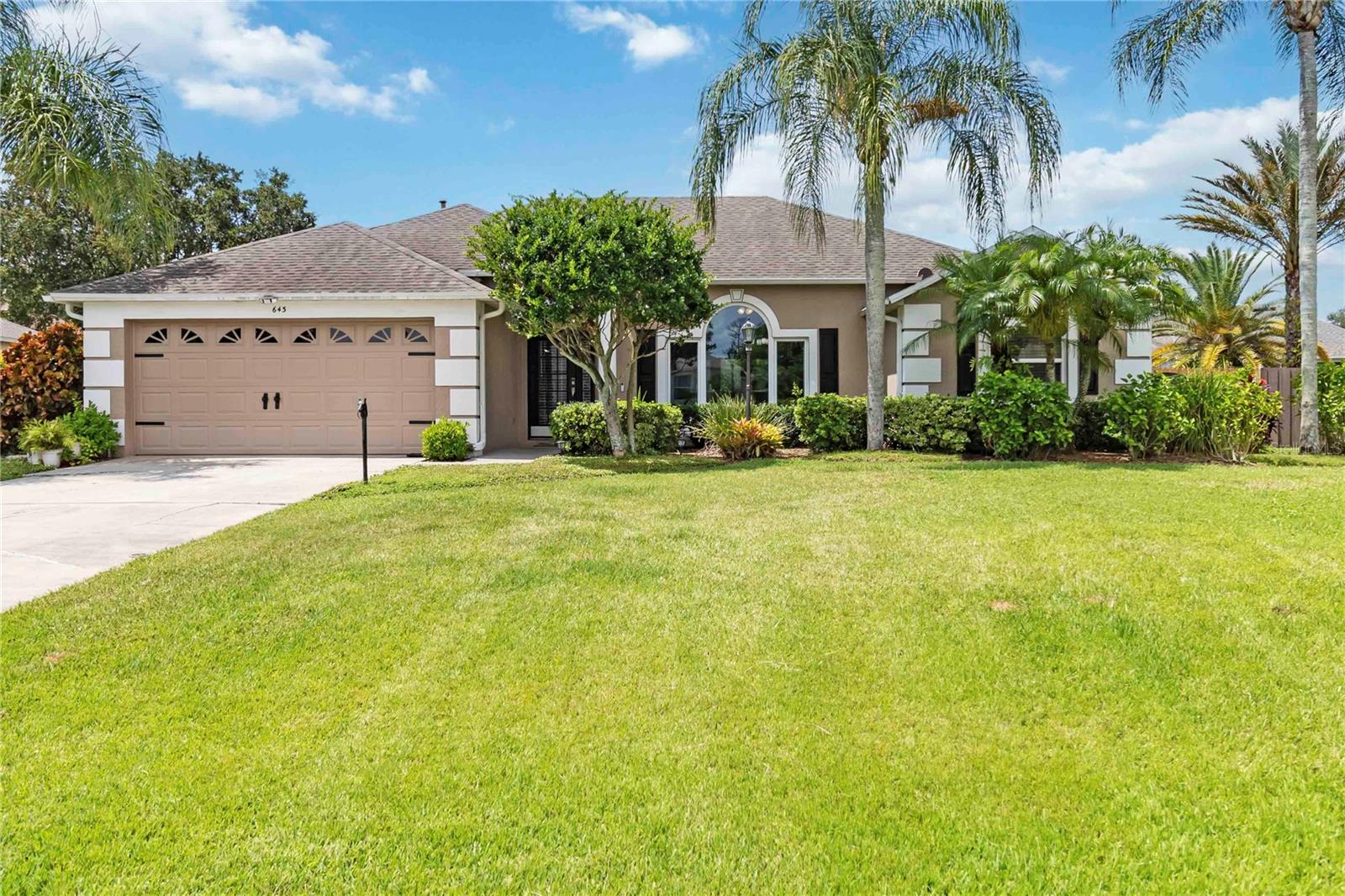 One or more photo(s) has been virtually staged. Welcome to this beautifully updated 4-bedroom, 2-bath split-plan pool home, a move-in-ready retreat that blends thoughtful upgrades with everyday comfort. This well-maintained residence features a newer roof, stainless steel appliances, fresh neutral interior paint, double thermal-pane windows and doors, and a resurfaced saltwater pool with solar heating and a refinished cool deck, perfect for enjoying Florida living year-round. Inside, you'll find two spacious living areas, with a centrally located, well-appointed kitchen featuring a gas stove, ample counter space, and updated appliances. The kitchen opens to a cozy family room with a gas fireplace, ideal for entertaining or relaxing evenings at home. The oversized primary suite offers privacy and space, while three additional bedrooms are positioned on the opposite side of the home in a desirable split floor plan. Enjoy lake views from the front yard and unwind in the peaceful backyard oasis complete with a covered lanai and sparkling pool. The layout, outdoor space, and modern updates make this home an excellent option for families, first-time buyers, or anyone seeking a comfortable and functional floor plan. Located just 5 minutes from I-4, this home provides easy access to Orlando, Daytona Beach, and other major Central Florida destinations. Zoned for Deltona Lakes Elementary, Galaxy Middle, and Deltona High School, all within a short drive. You'll also enjoy proximity to local favorites like Lyonia Preserve, Dewey O. Boster Sports Complex, shopping centers, and a variety of dining options, all within 10 minutes or less. Don’t miss the opportunity to make this beautifully updated pool home your own. Schedule your private showing today!
