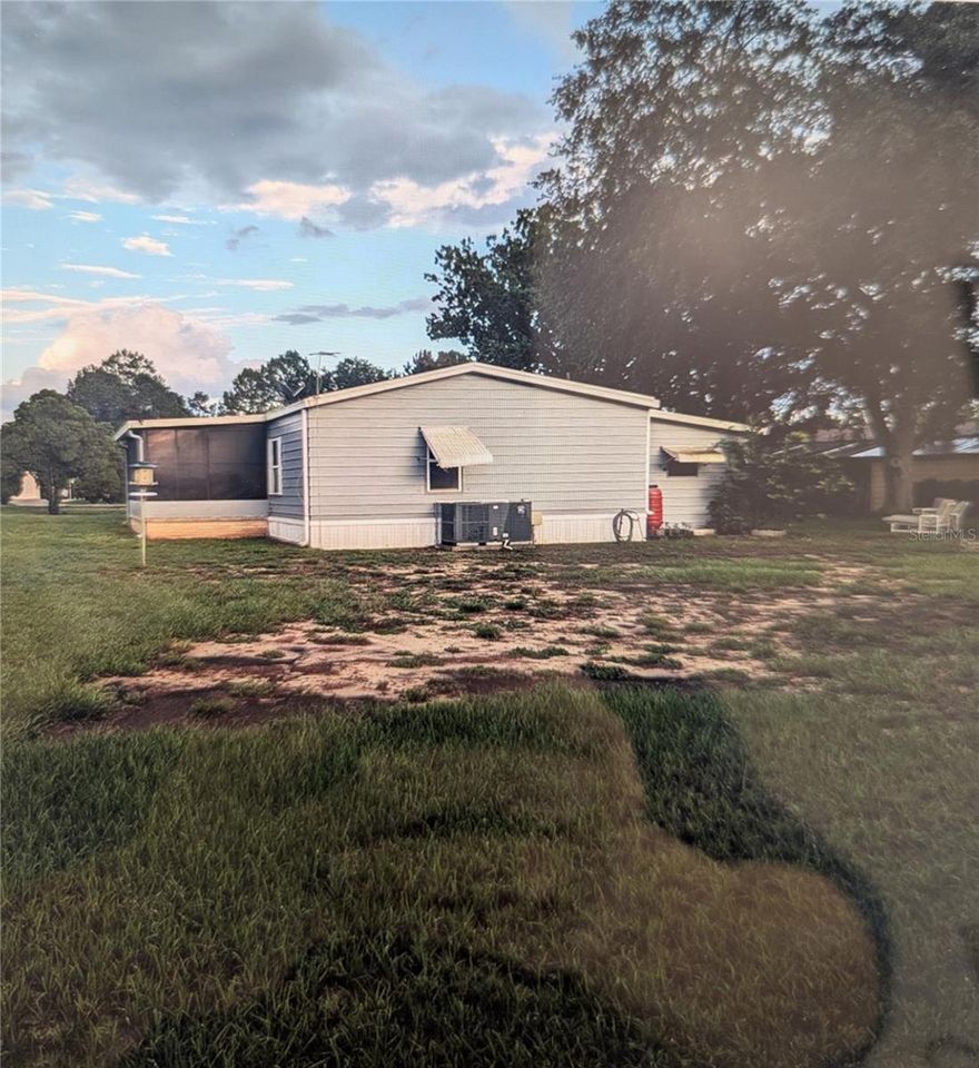 Welcome to this charming 2 bd, 2 full bath, manufactured home nestled in a sought-after 55+ golf community just minutes from Walt Disney World. Tucked away on an oversized lot, on a 
cul-de-sac street, this home offers a peaceful setting with minimal traffic—perfect for relaxing and enjoying Florida living at its best.

The community features two beautifully appointed clubhouses, each with sparkling pools, and an active golf lifestyle, providing endless opportunities for recreation, social events, and leisure. Whether you’re spending your mornings on the course, afternoons by the pool, or evenings with neighbors and friends, this community delivers a true resort-style experience.

Conveniently located near world-class attractions, shopping, dining, and medical facilities, this home is ideal as a full-time residence or a seasonal retreat. Enjoy the best of Central Florida—sunshine, serenity, and an unbeatable location—all in one exceptional community.

Come experience relaxed, active living where every day feels like a vacation!