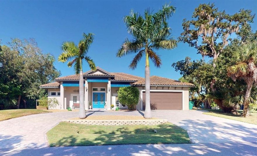 Dreaming of gulf access waterfront with enough land to have a quiet waterfront retreat or gathering place?  This incredible 2017 built home is just that and more- exquisite construction by Harden Dukes- the Barbados model has 2 en-suites- a 3rd bedroom with access to lanai, and an office/den- with over 2400 sq feet under air there is room for everyone. Apollo waterway is a straight shot to the river  (one canal and two bridges) with quick access to the harbor and gulf beyond.  This kitchen is a chefs dream- with sub zero refrigerator and freezer- walk outside to your raised bed garden center for fresh herbs or vegetables! The architectural extra features are stunning, the zero pocket sliding glass door marries the interior to the spacious pool area and lovely landscaping. The incredible upgrade tile flooring -looks like the finest wood!   Outside past the heated pool and oversize lanai area there is an entire park like setting with 2 sheds(electric/secured) picnic area with lighting for evening events.  The front of the home is majestic with the two sets of French doors- one for the second en-suite- a private entrance for an in-law or guest - and the second set enter the office.  Those both go ourt to the 33 foot front porch- a place to Rock and Reflect!  There are three peach trees along with 2 mango, 3 fig, an avocado, lemon, tangelo and grapefruit! A whole home reverse osmosis system provides the best in drinking water. The electric panel is pre wired for a backup generator for power when you need it.  The tile roof has secondary water resistance for extra protection. The lanai ceiling and entry ceiling done in cypress for worry free maintenance.  If you would like more land the lot next door can also be purchased (separate owner) and it has a massive tree house on it!   Enjoy the video and floor plans; better yet come take a personal tour to find your waterfront retreat.